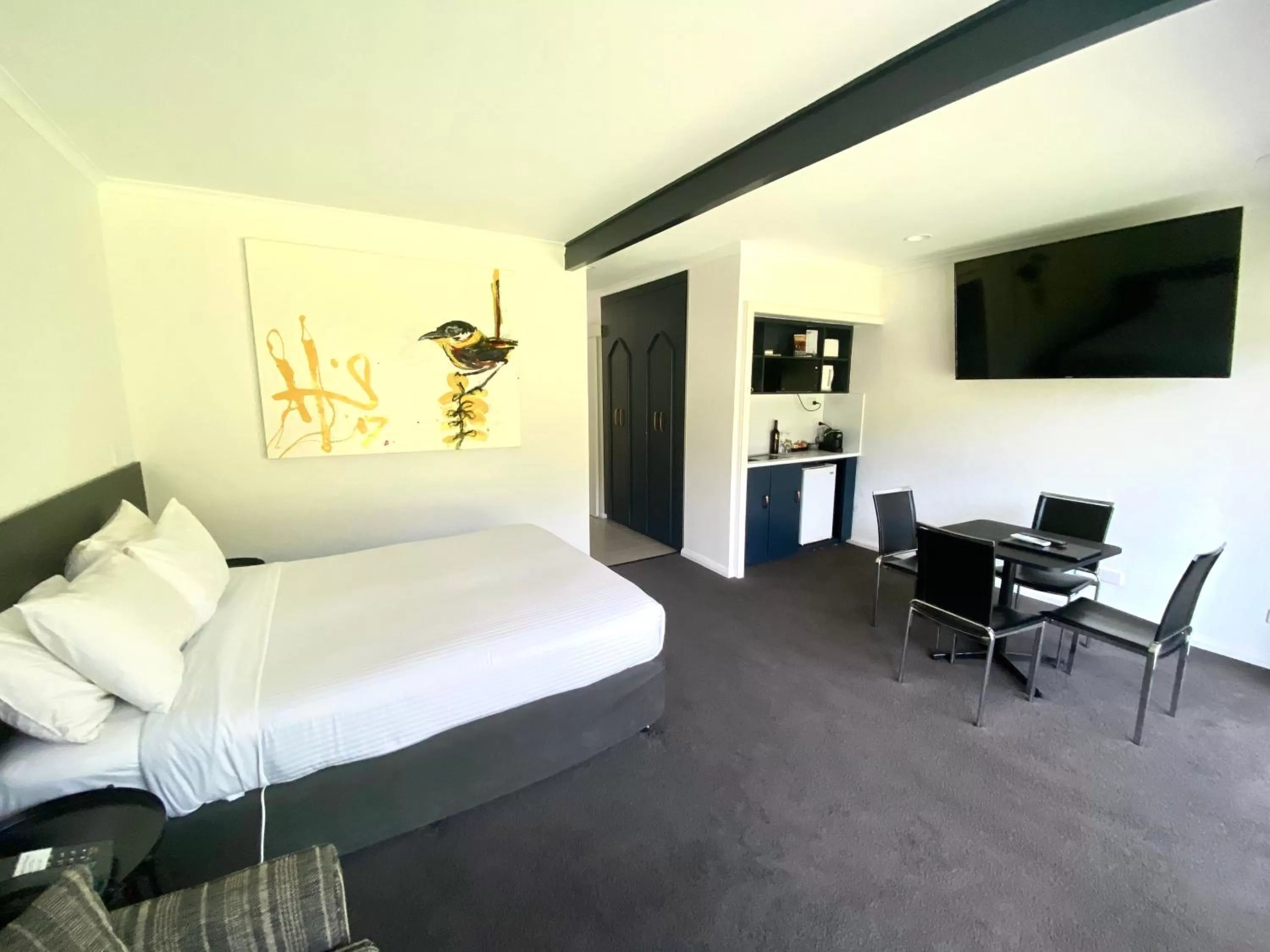 Bed in William Macintosh Motor Lodge