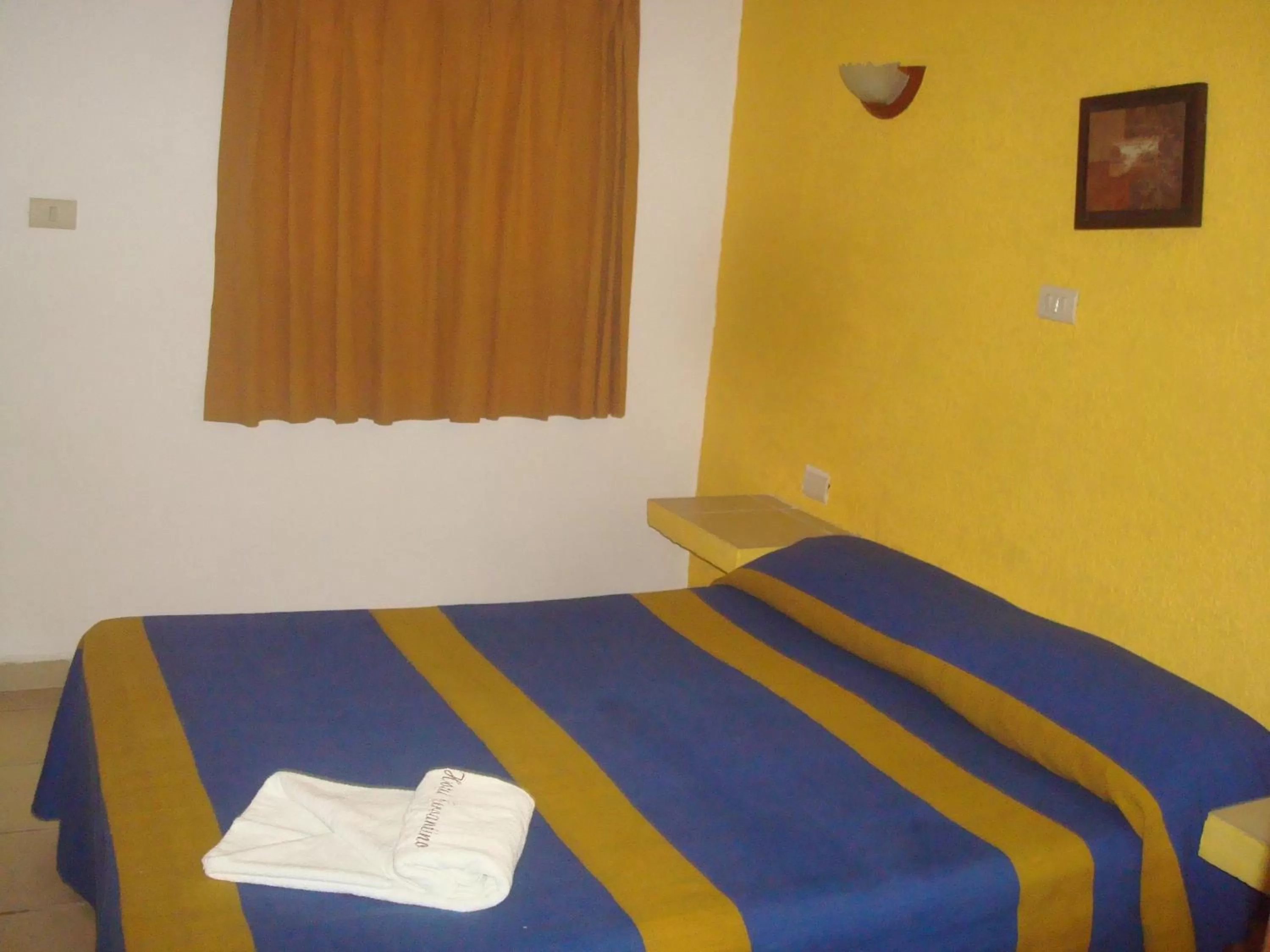 Bed in Hotel Cervantino