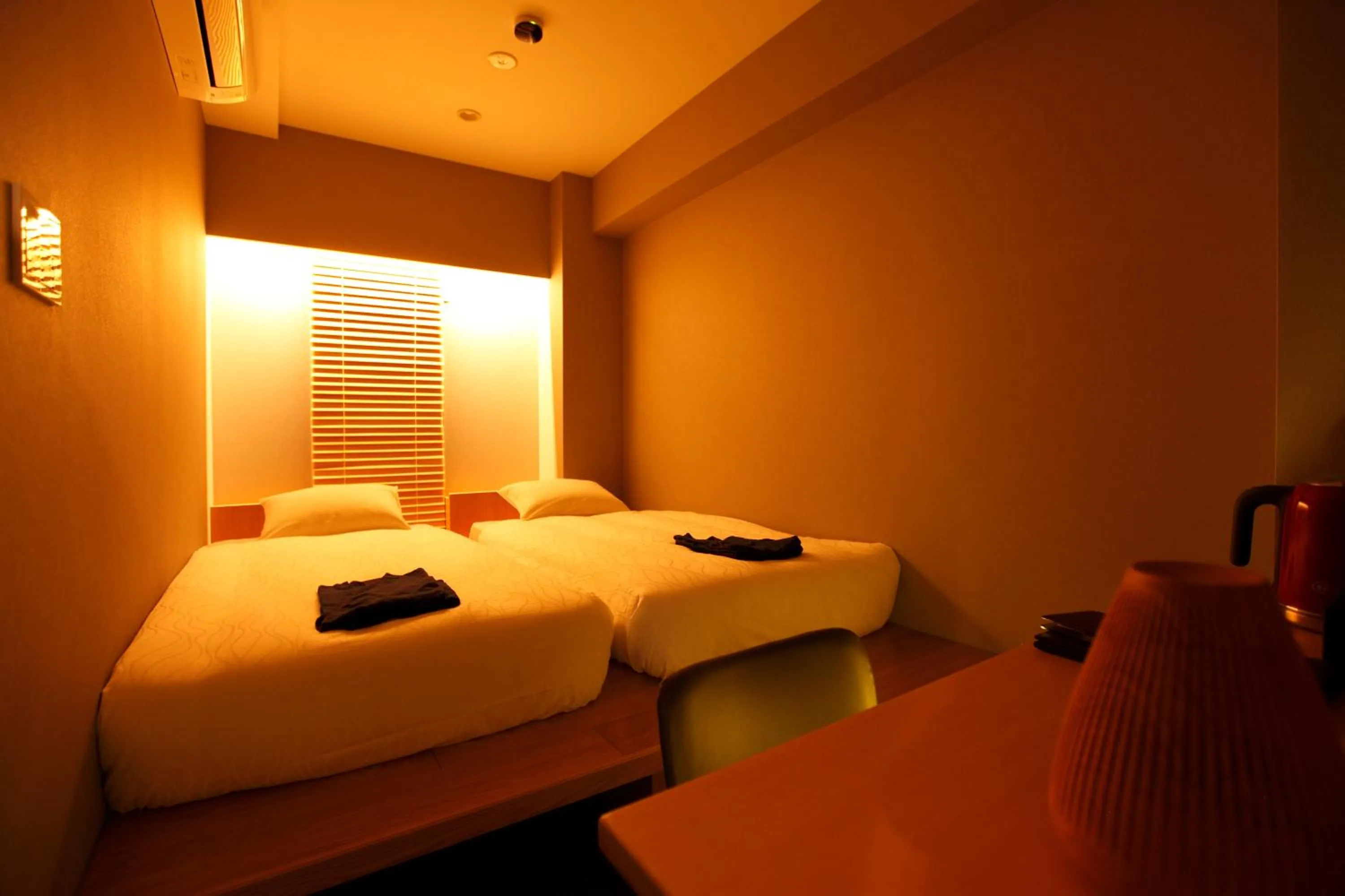 Bed in HOTEL AMANEK Ginza East