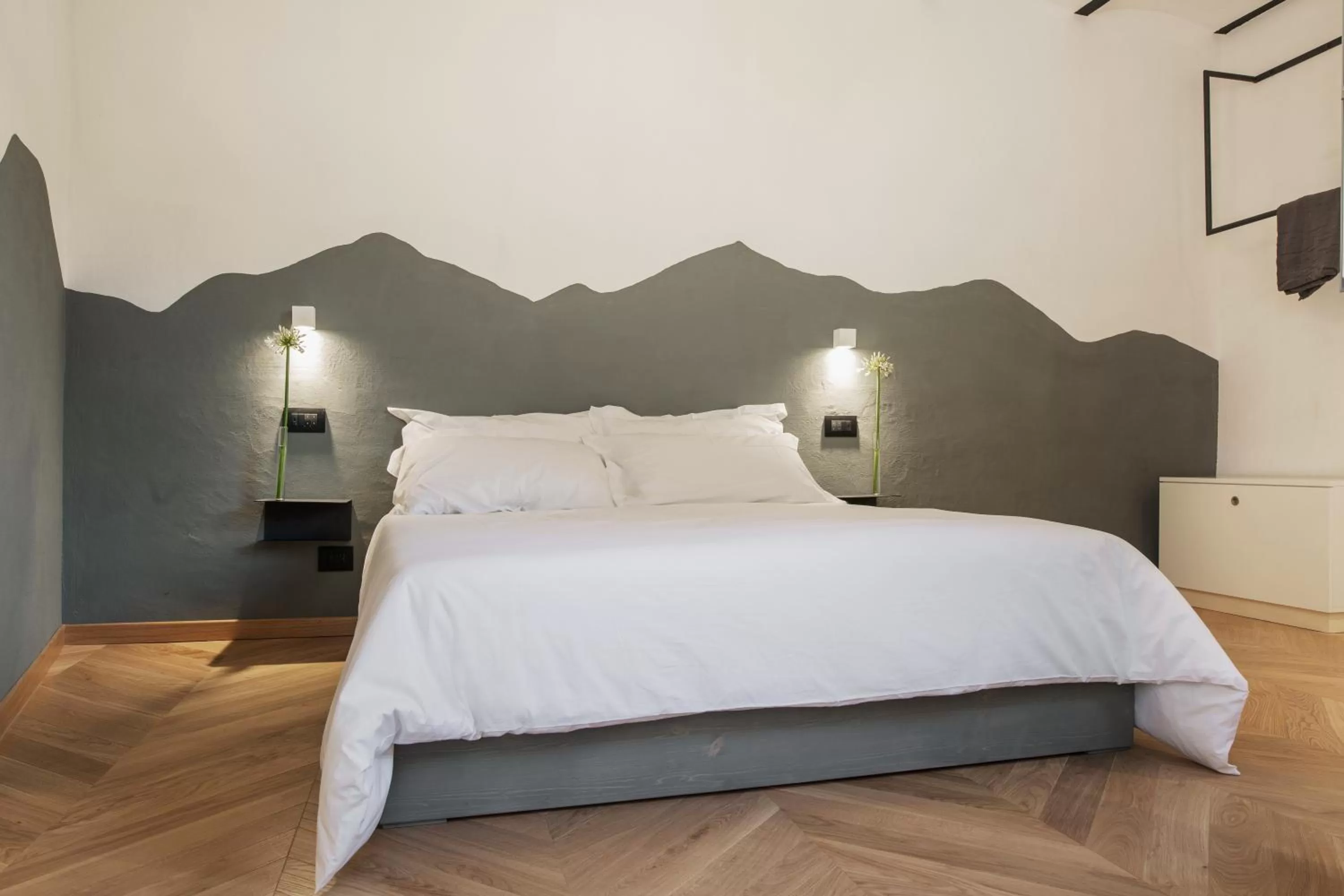 Bed in OGNISSANTI GuestHouse & Suites