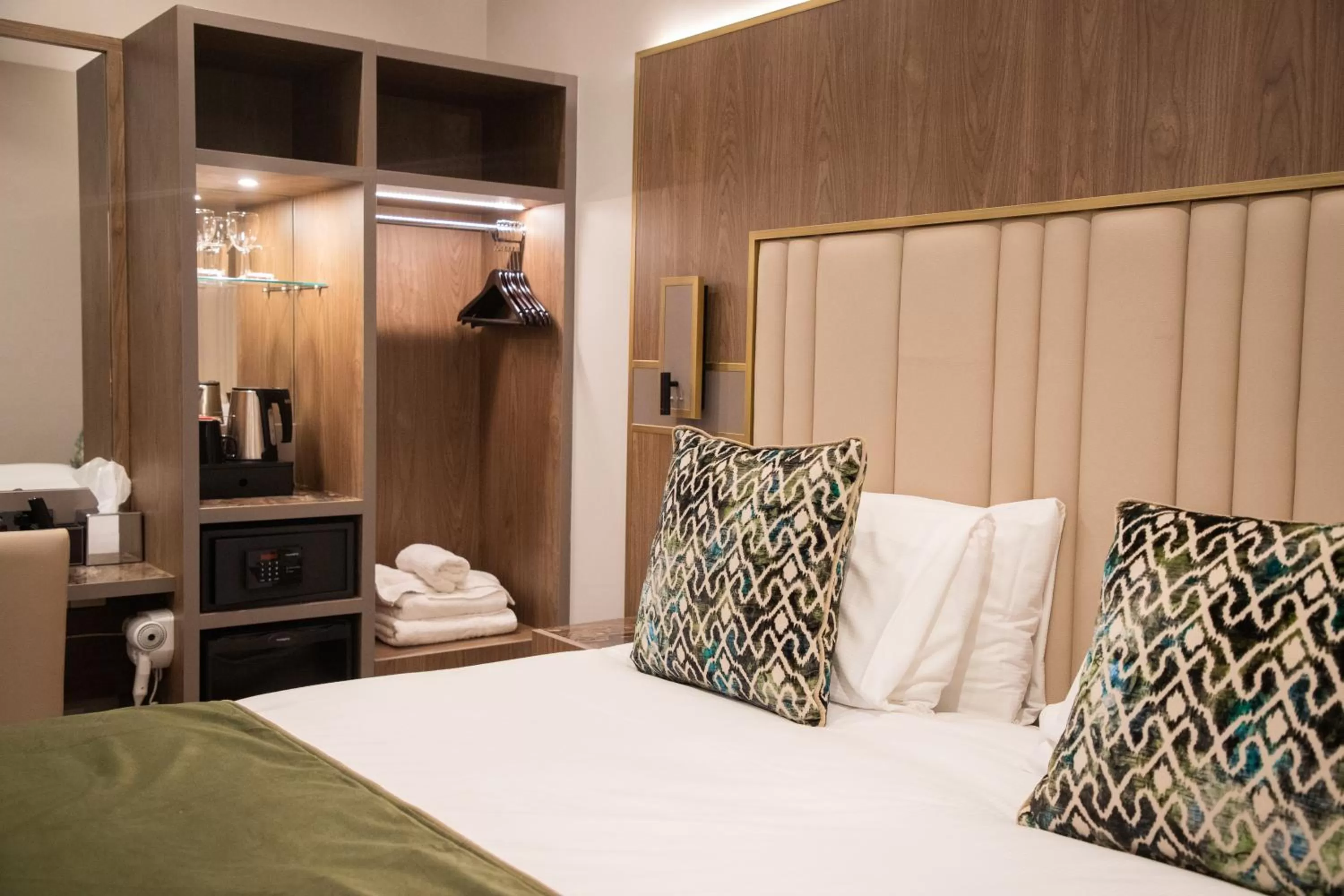 Bed in Merit Kensington Hotel