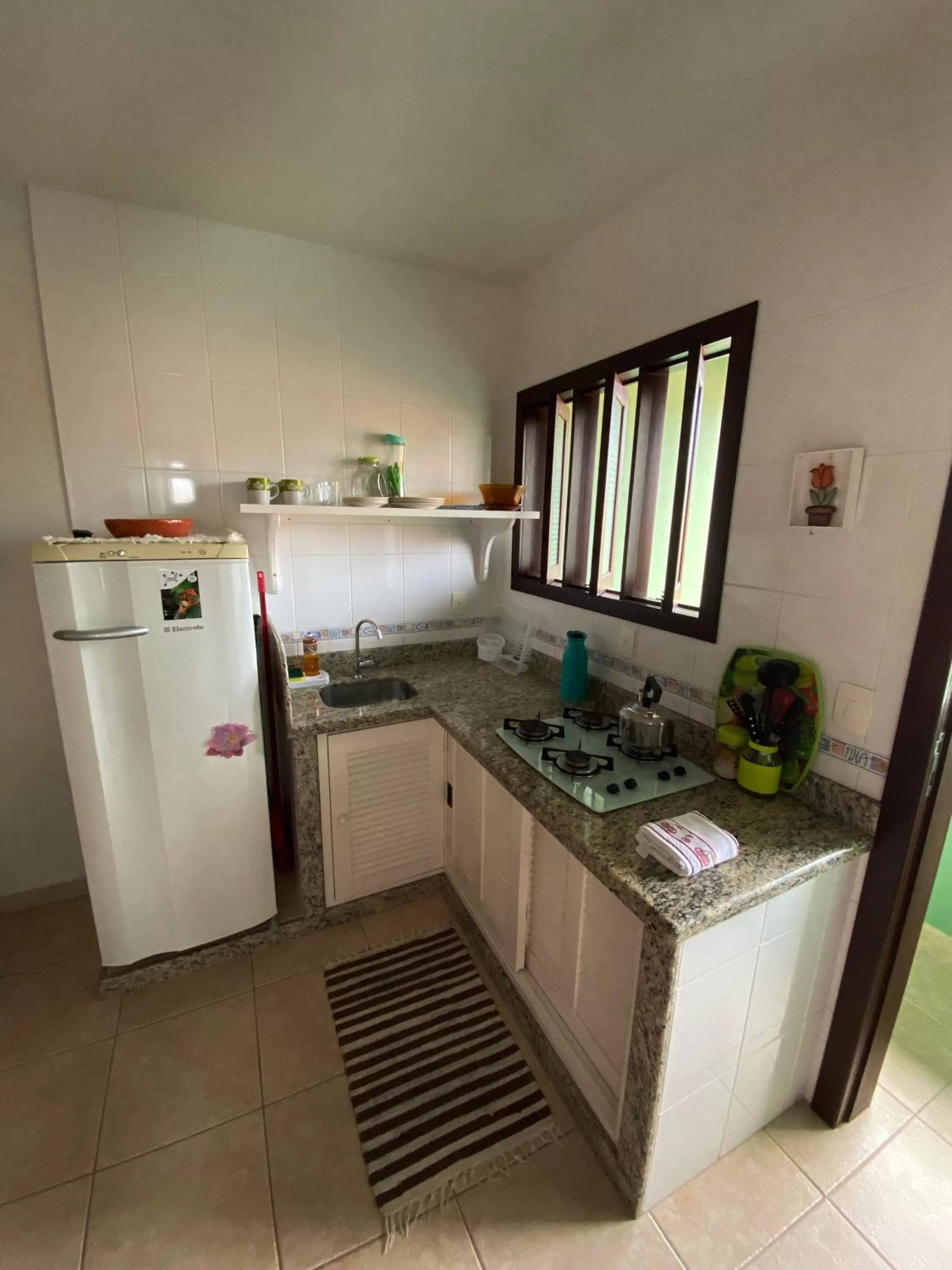 Kitchen/Kitchenette in Canto Leste Pousada