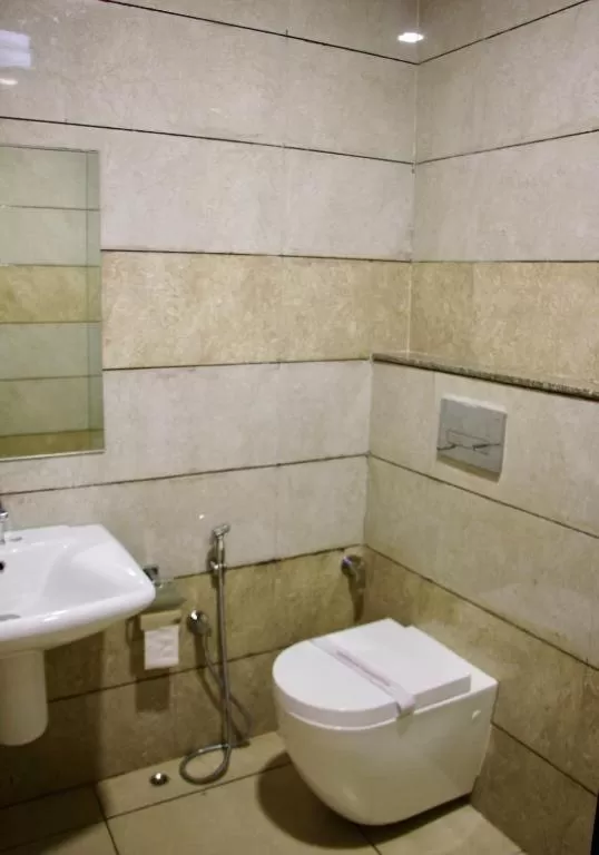 Bathroom in Hotel Reva Regency