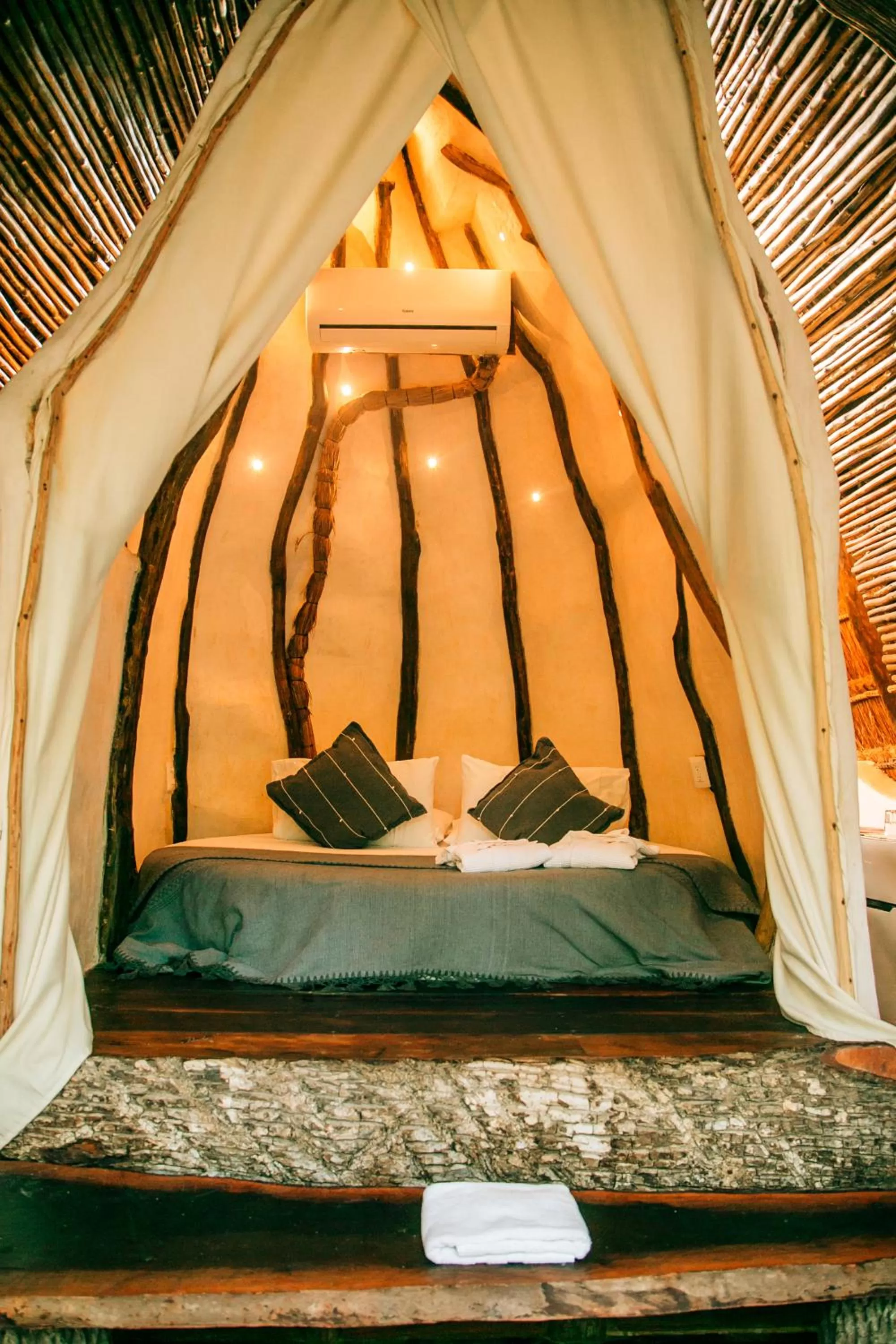 Bed in Ikal Tulum Hotel