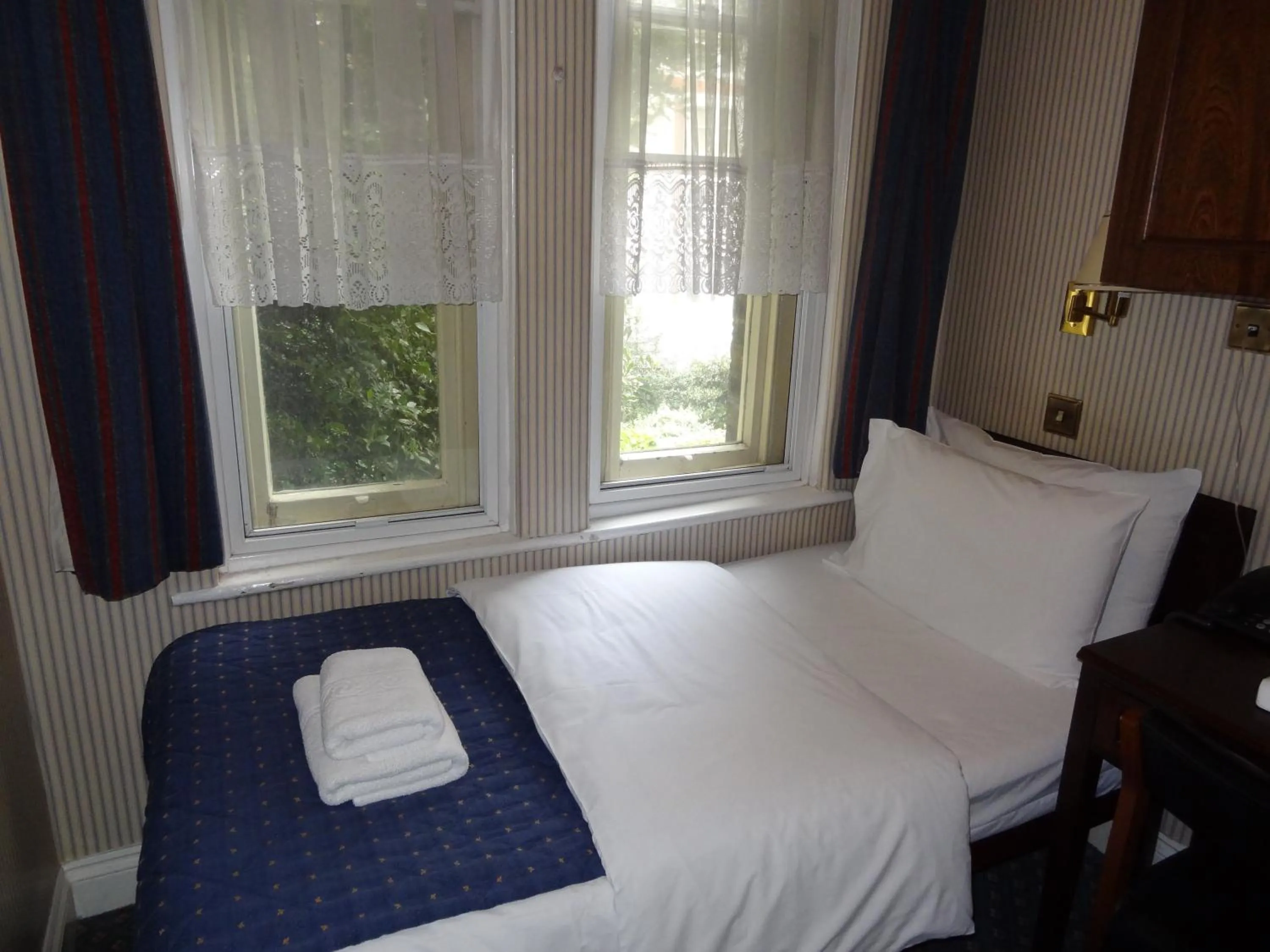 Bed in Regency House Hotel