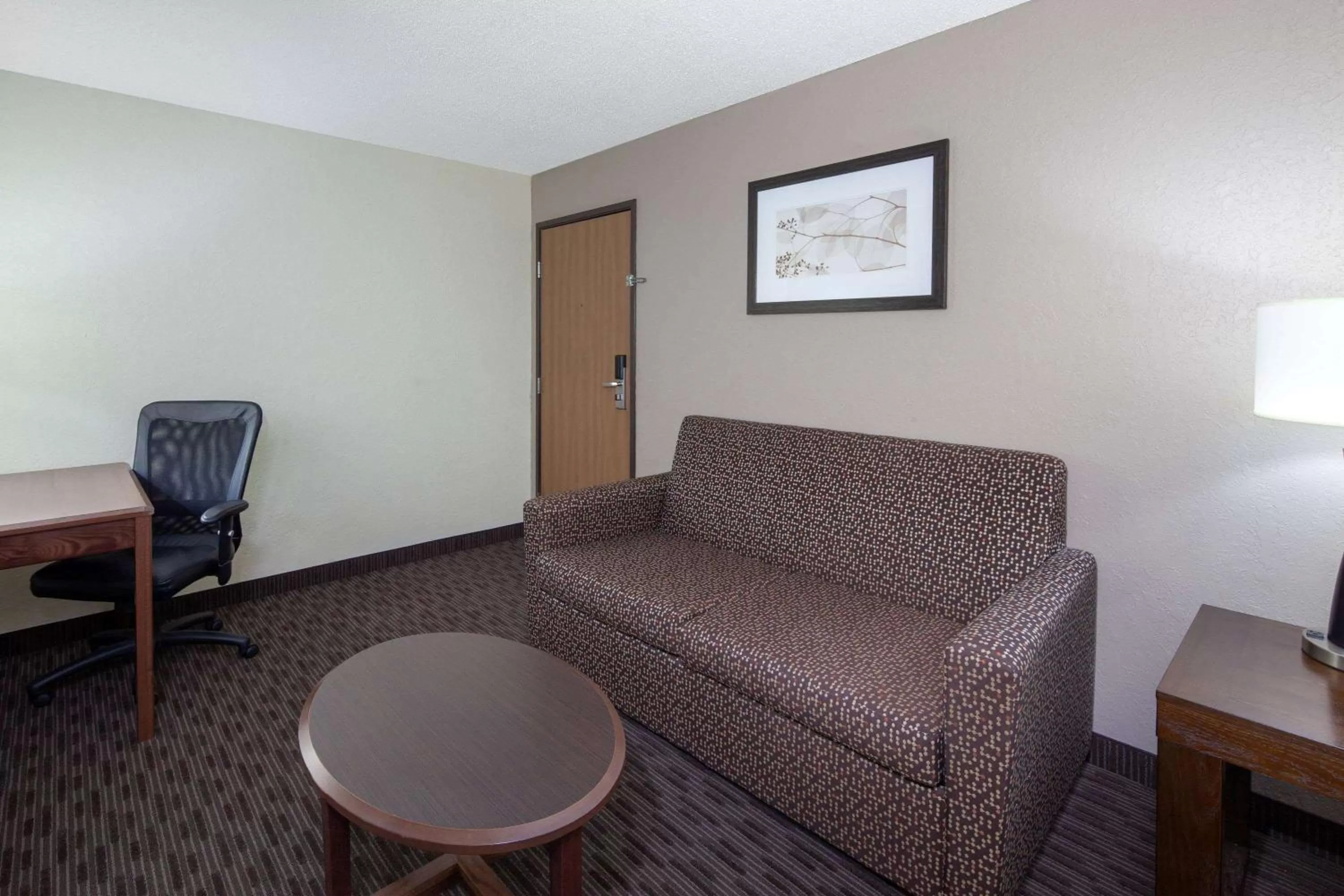 Living room in AmericInn by Wyndham Ironwood