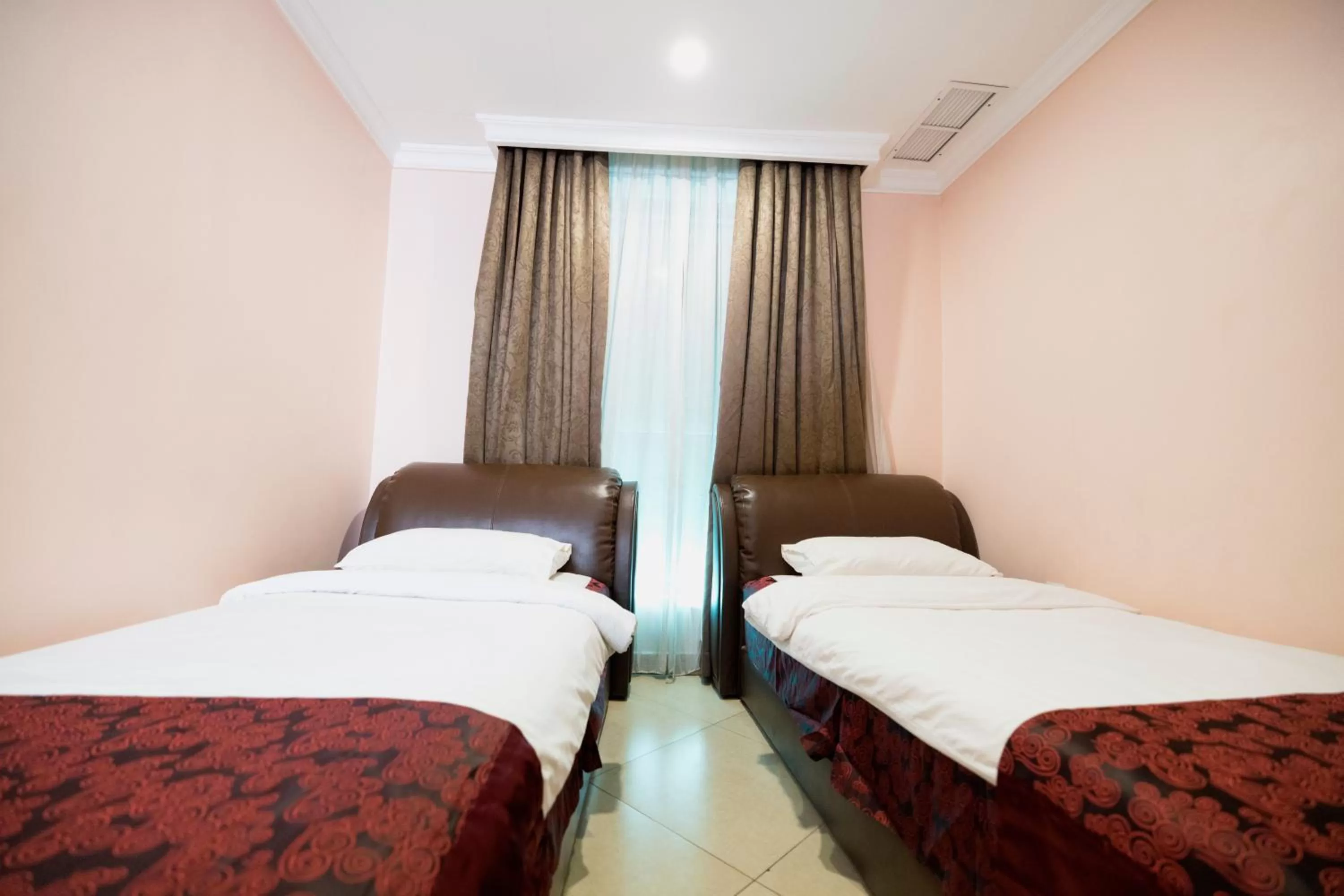 Bed in Laguna Hotel Suites