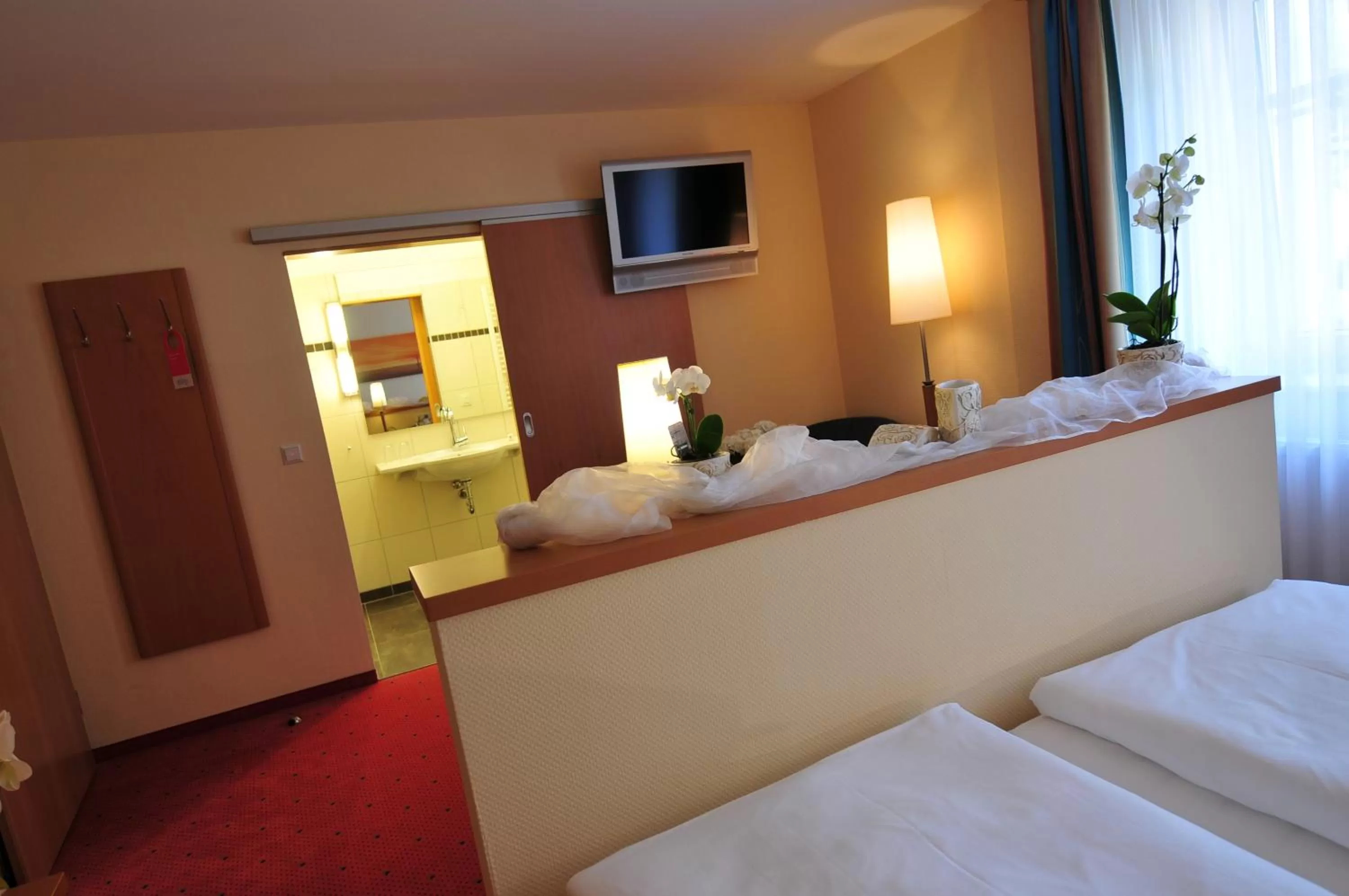 Bed in Flair Hotel Deutsches Haus