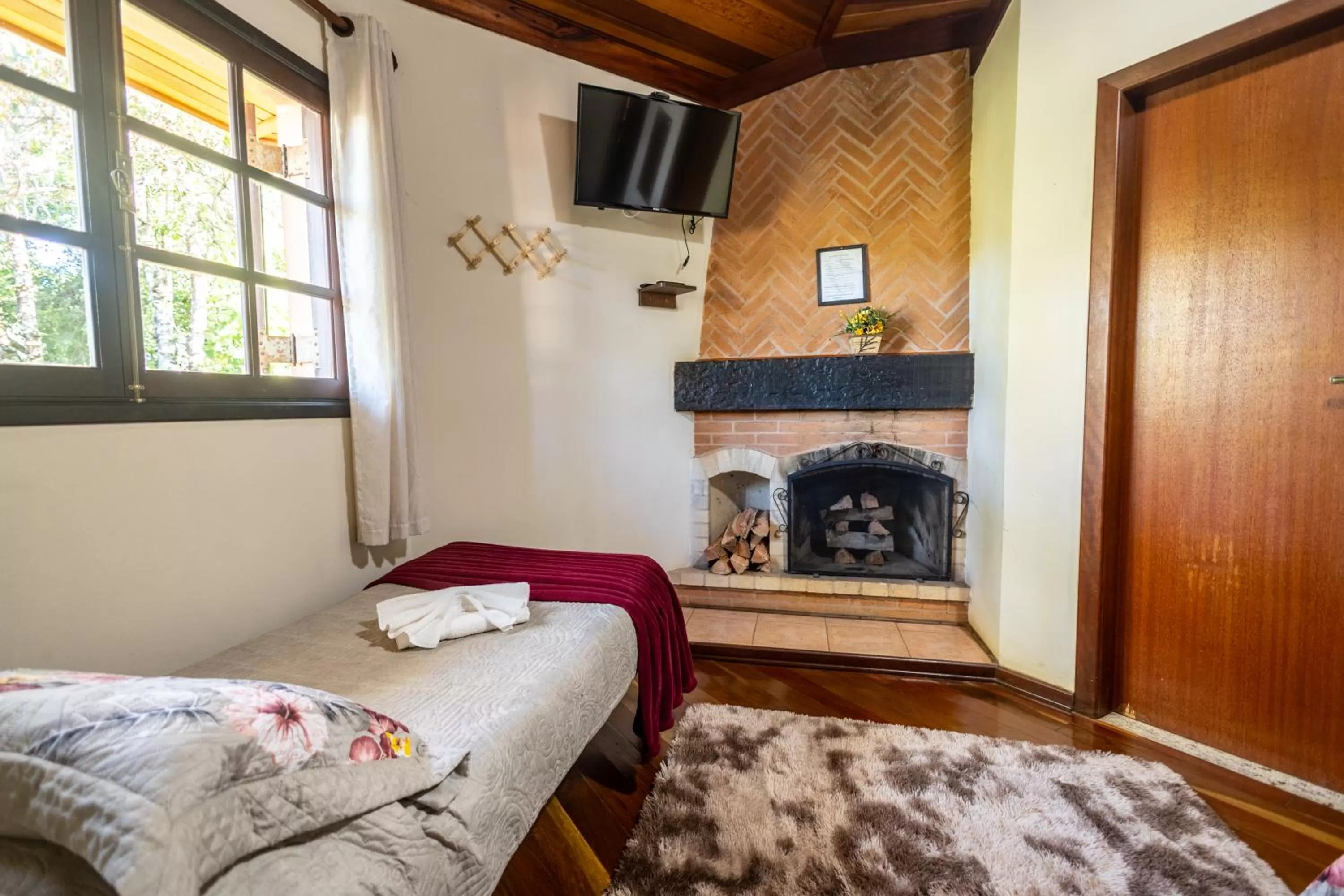 Bed in Chalés 3 Pinheiros