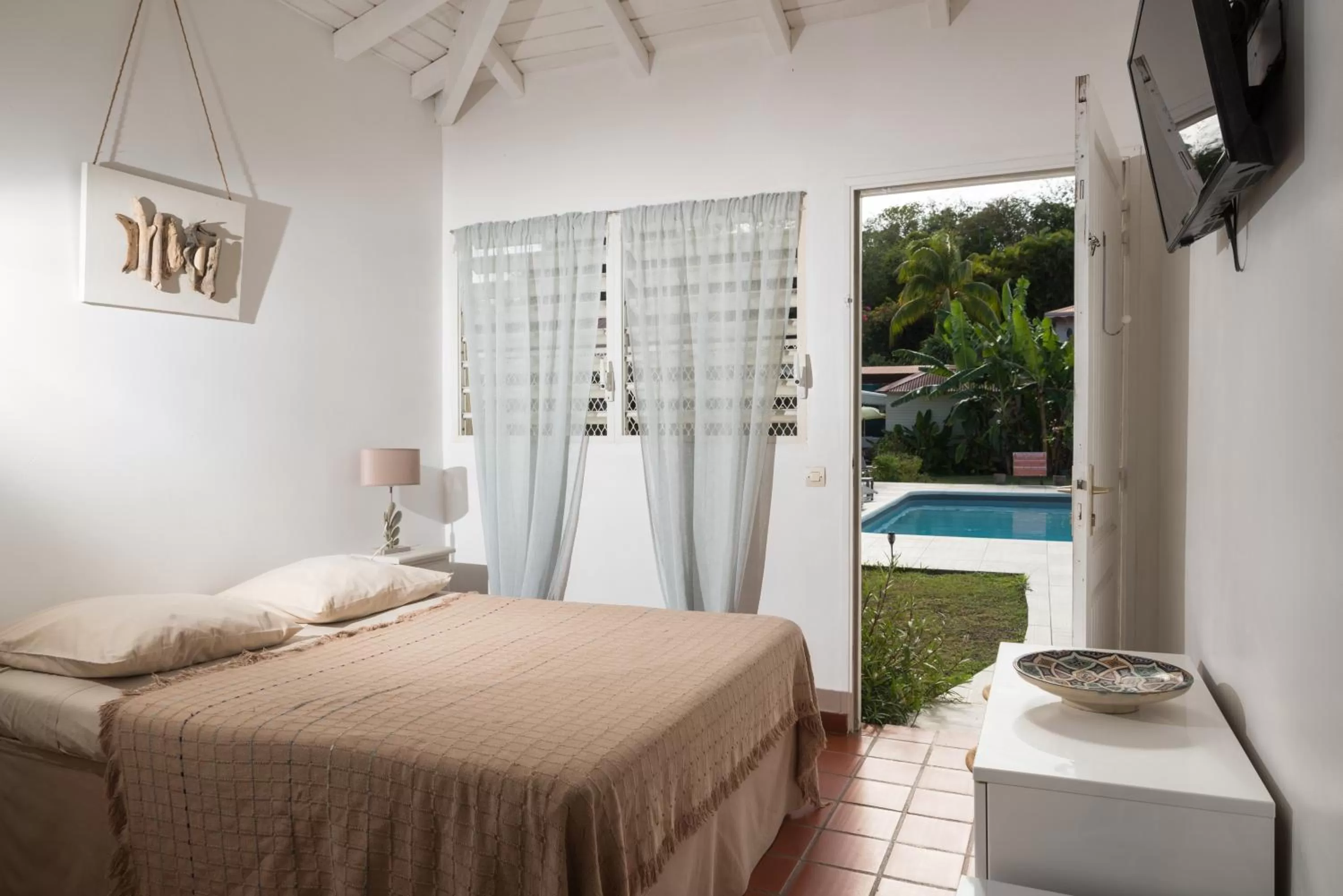 Bed in Hôtel Les Bananiers