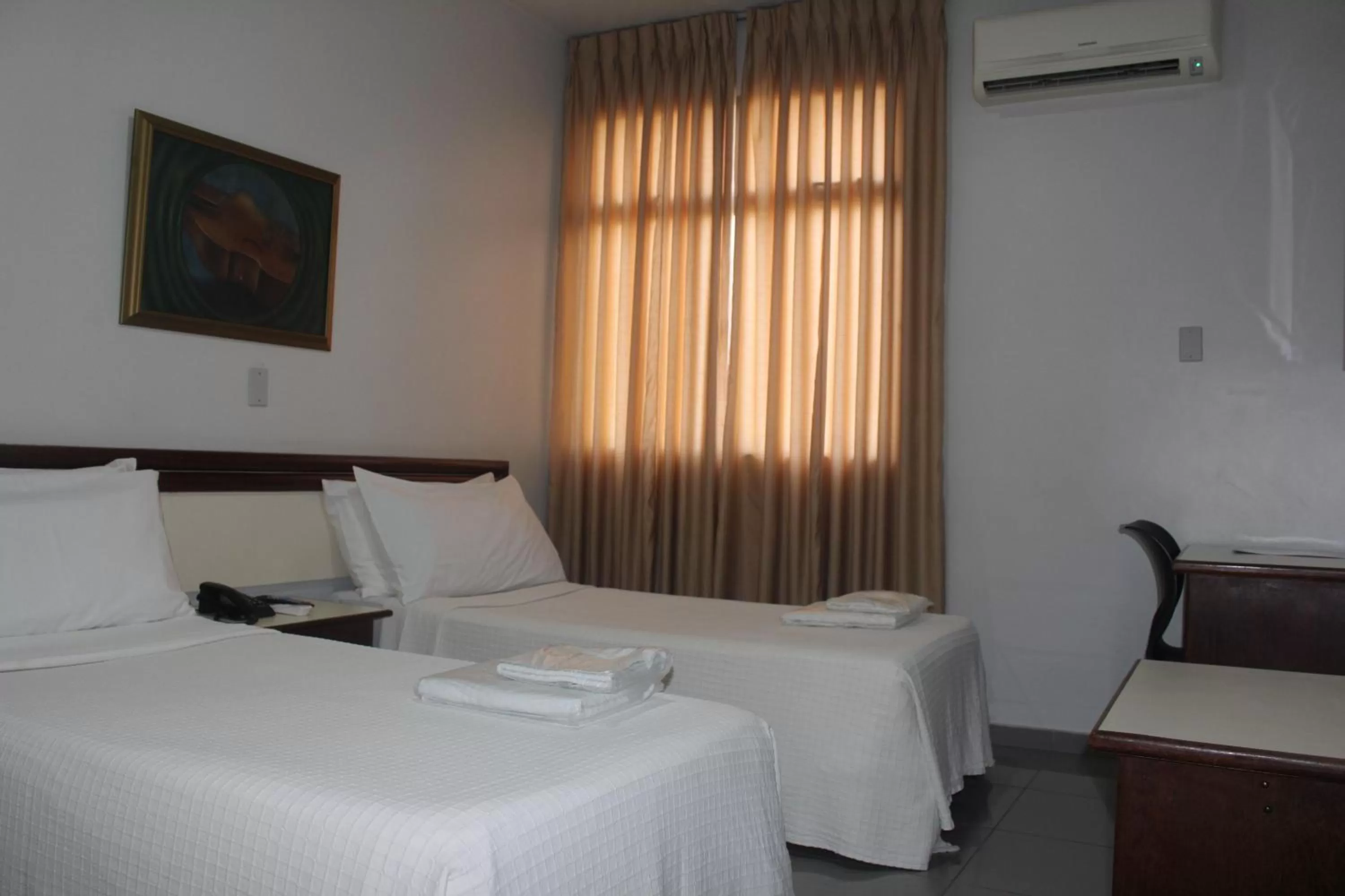 Bed in Hotel Oscar Econômico