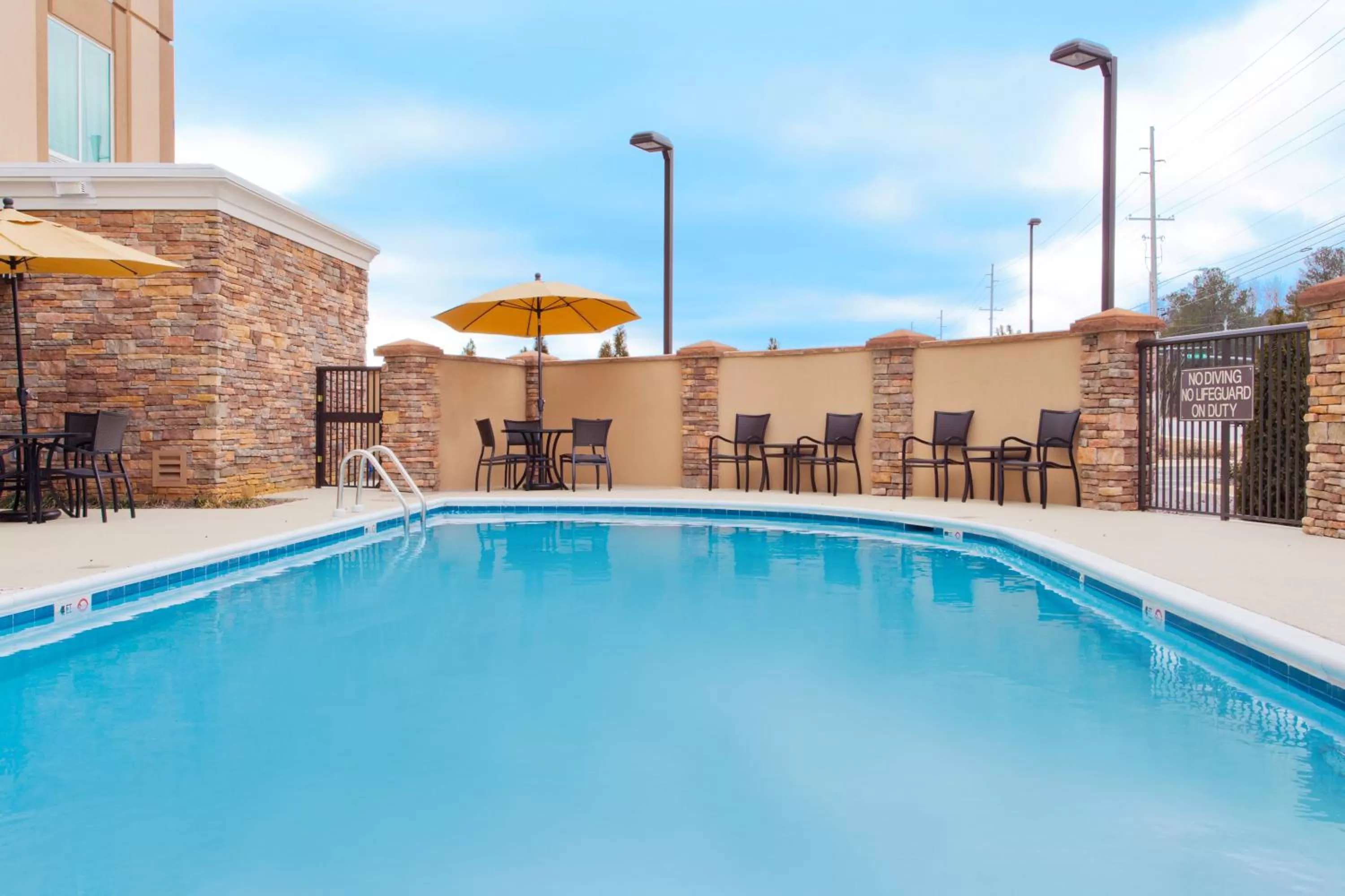 Swimming pool in Holiday Inn Express Hotel & Suites Huntsville West - Research Park by IHG