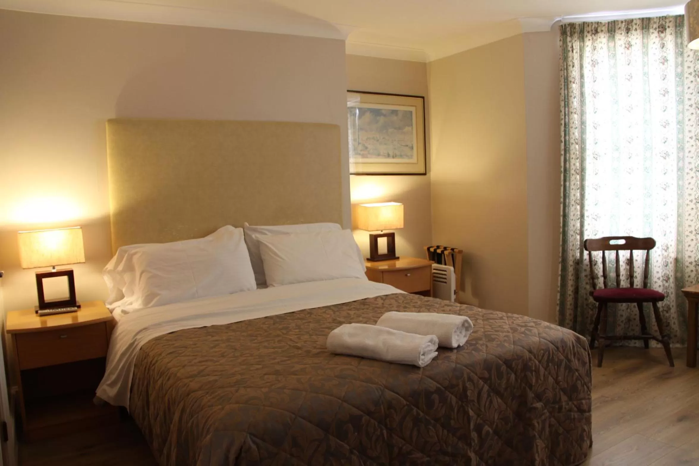 Bed in Ambassador Hotel