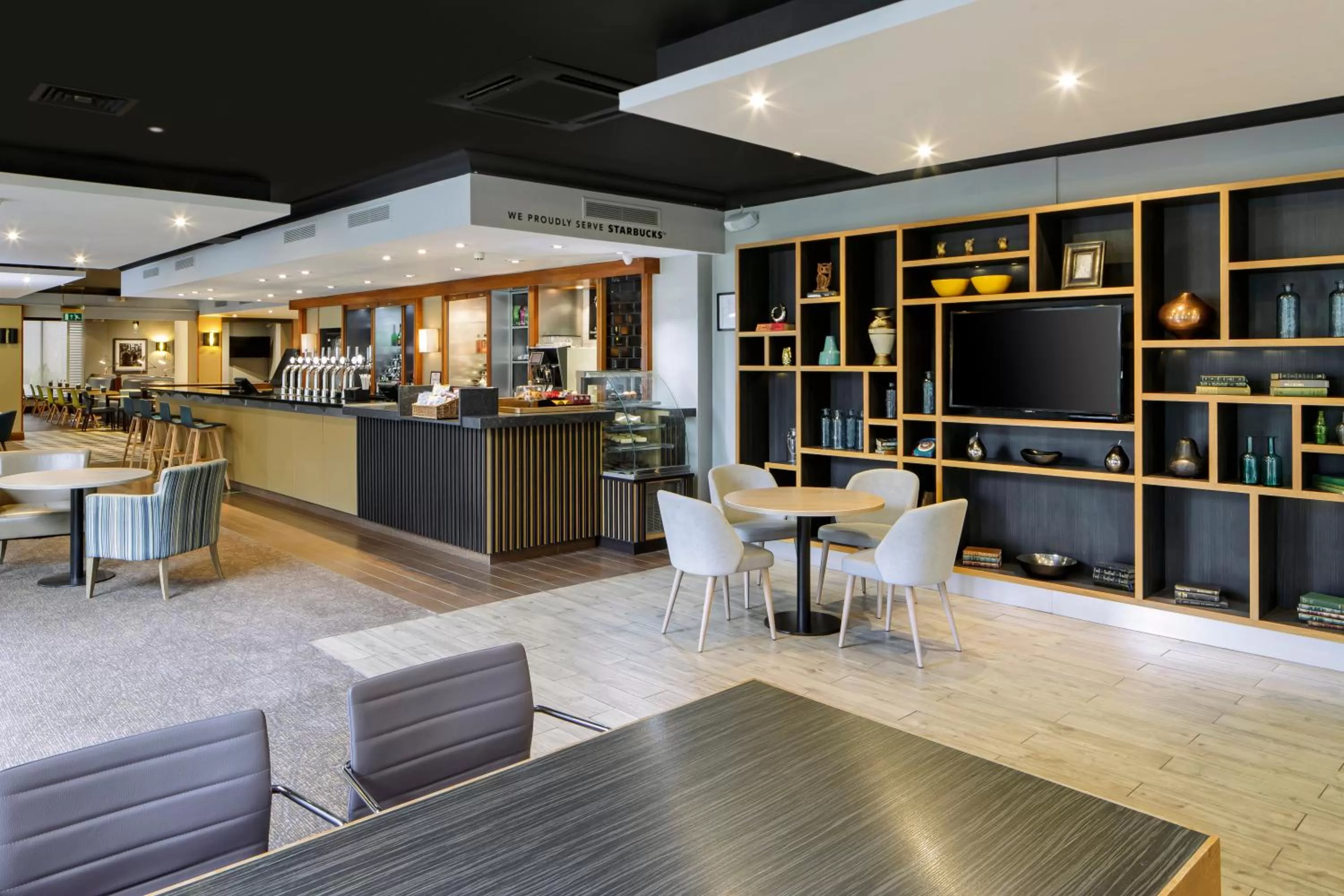 Lounge or bar in Holiday Inn Peterborough West by IHG