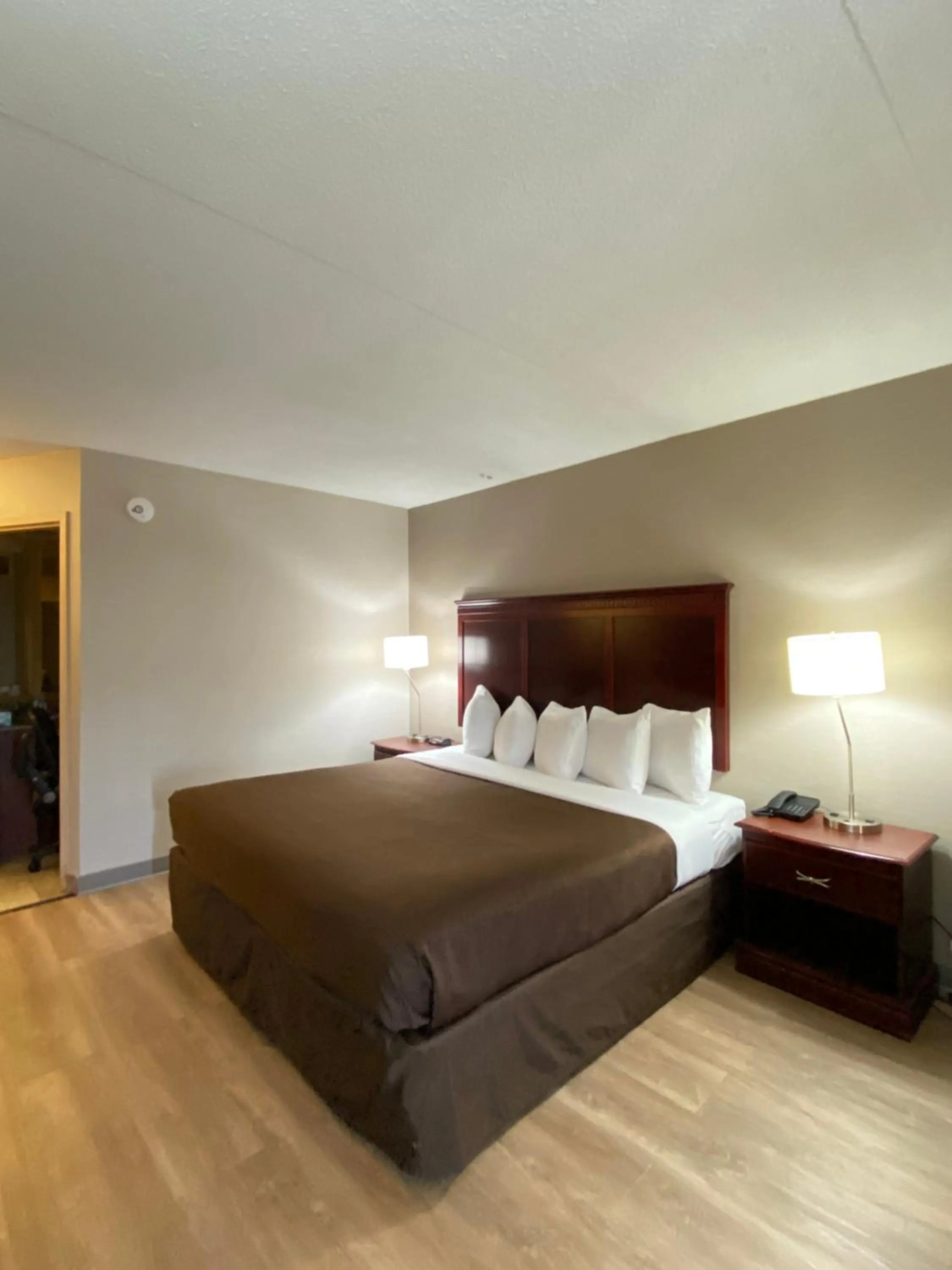 Bed in Clarion Inn & Suites Grand Rapids Airport