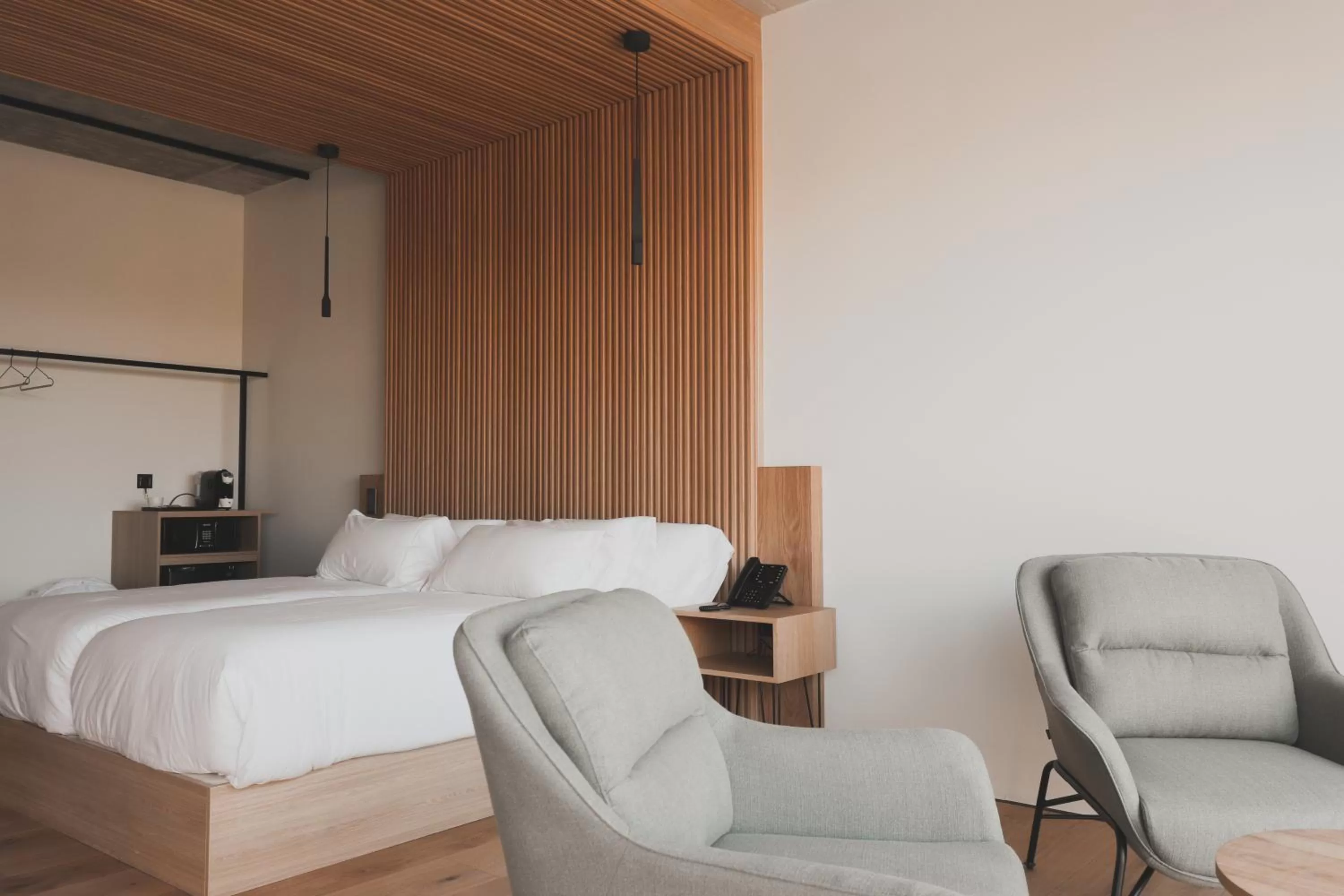 Bed in Atmos Hotel Boutique