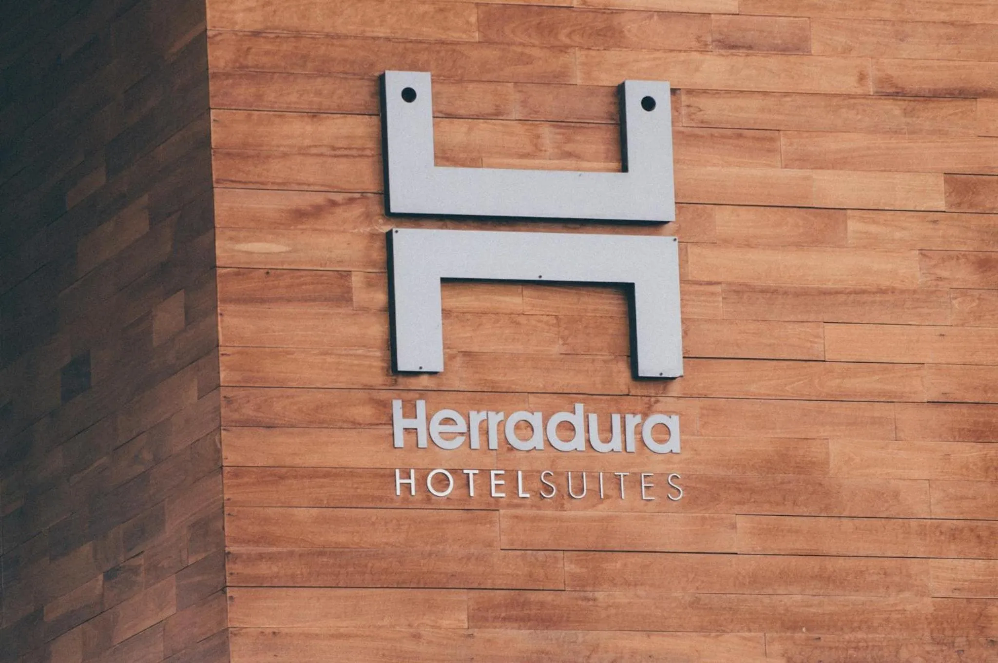 Facade/entrance in Herradura Hotel Suites