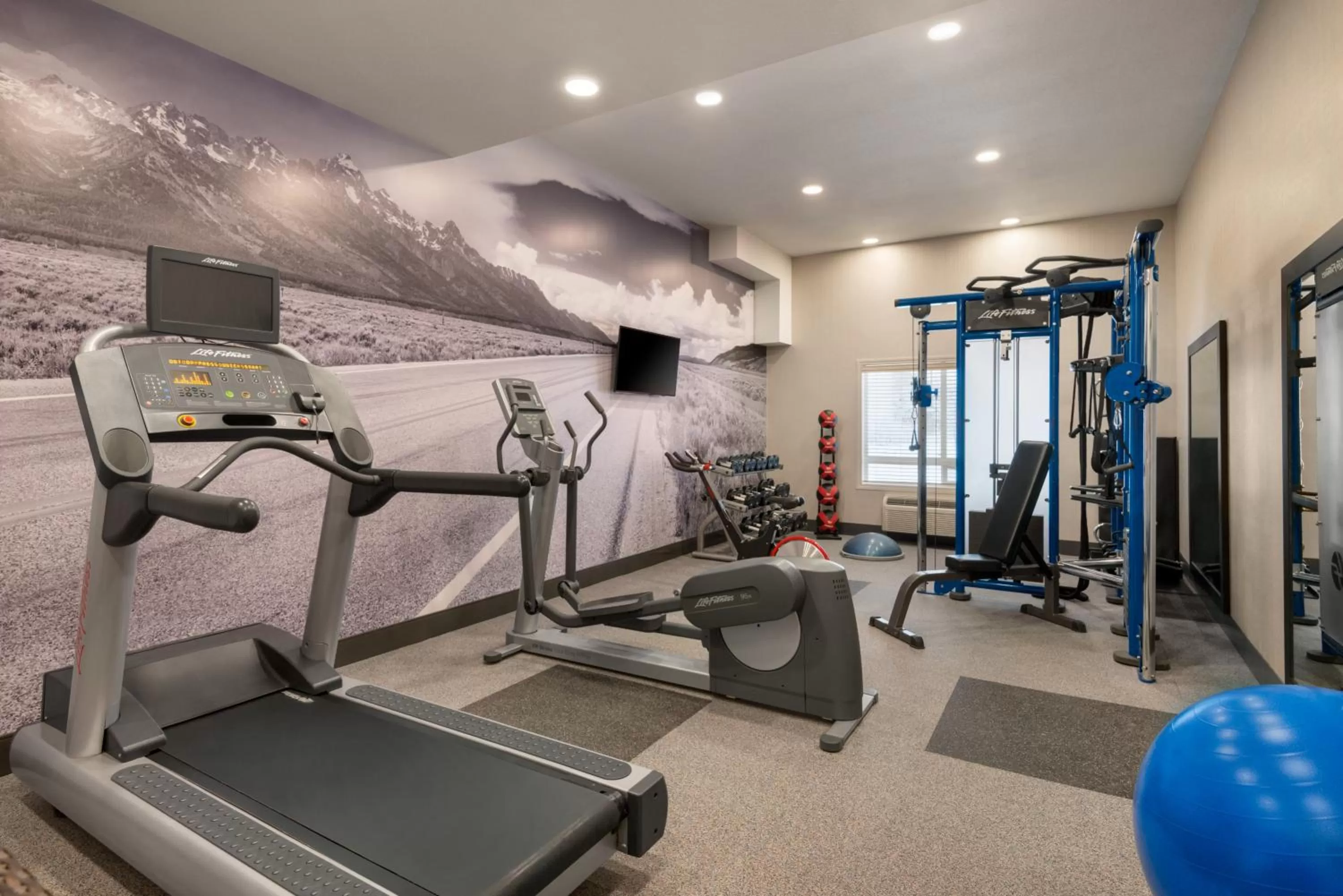 Fitness centre/facilities in Ramada by Wyndham Airdrie Hotel & Suites
