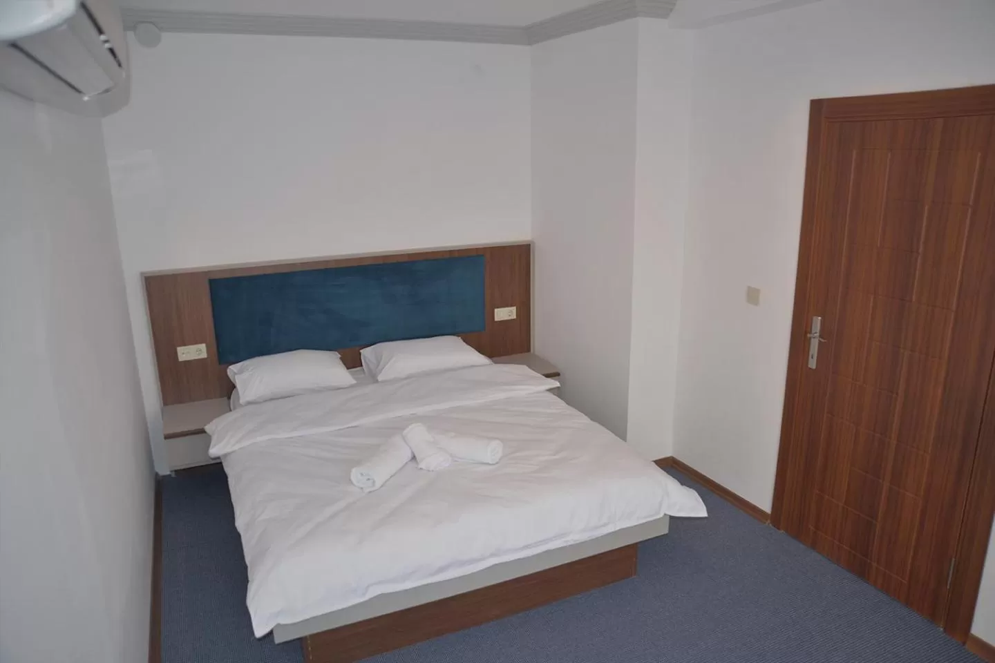 Bed in TEVETOGLU HOTEL