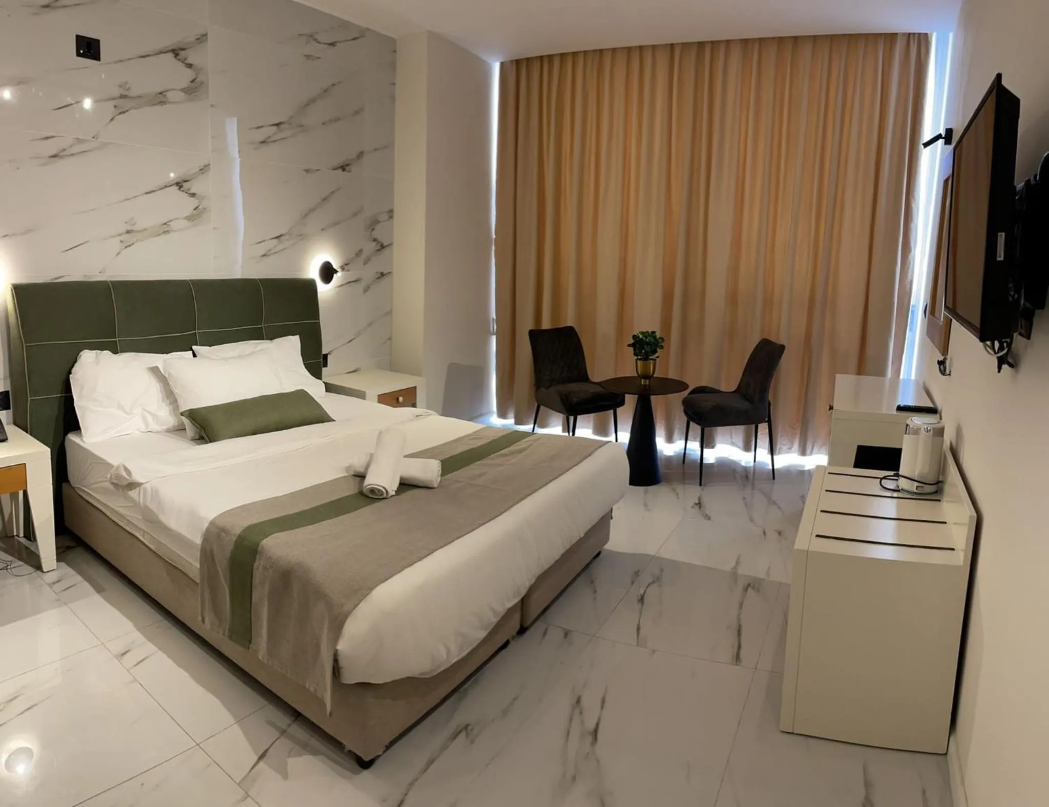 Seating area, Bed in Tabar Hotel