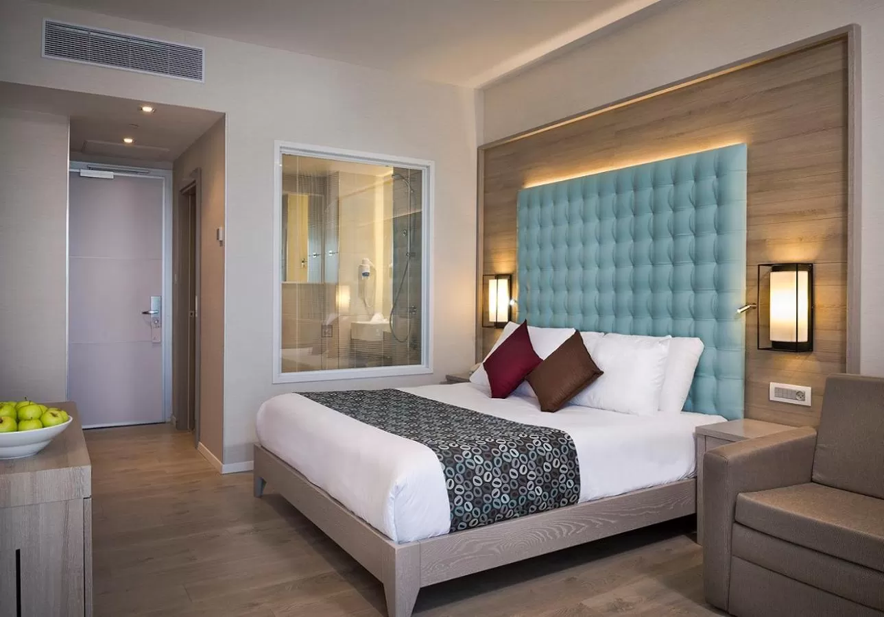 Bed in Astral Village Hotel