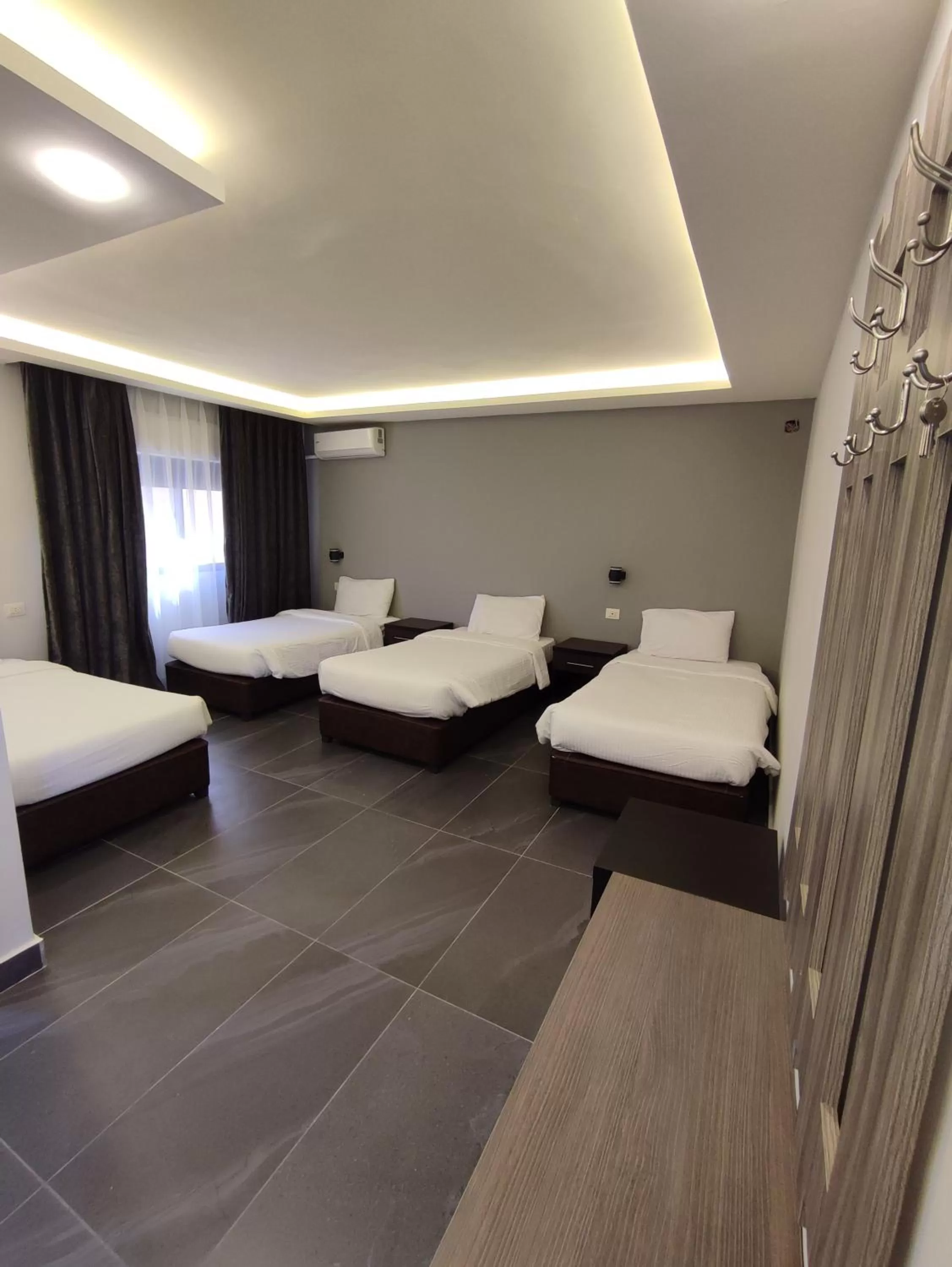 Bed in Black Iris Hotel