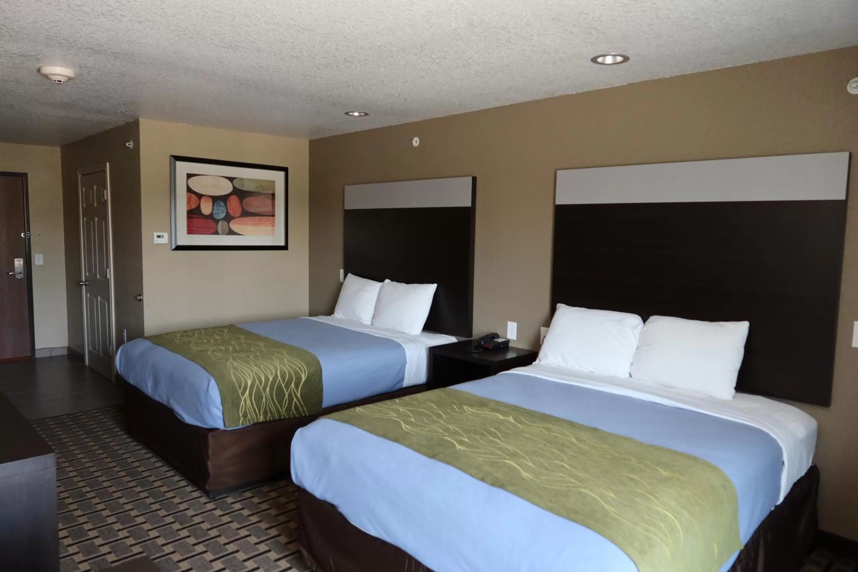 Bed in West Worth Inn & Suites White Settlement