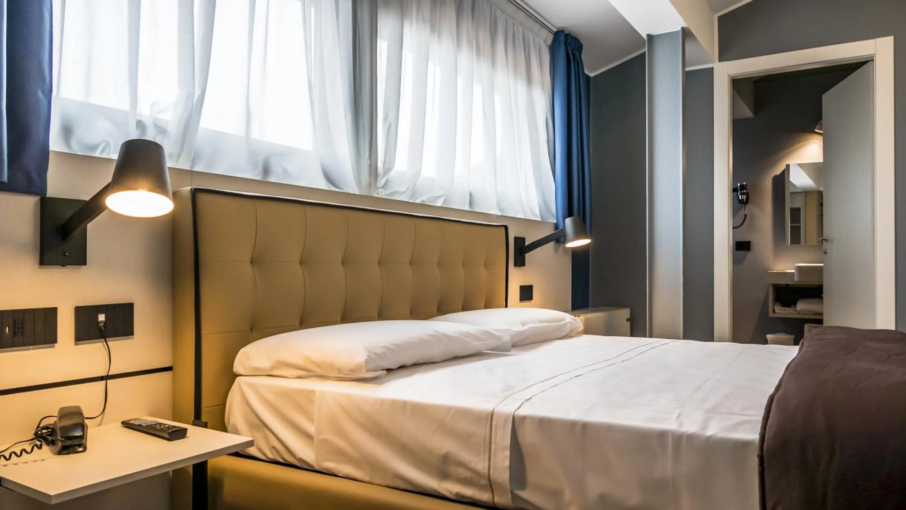 Bed in Hotel Puccini