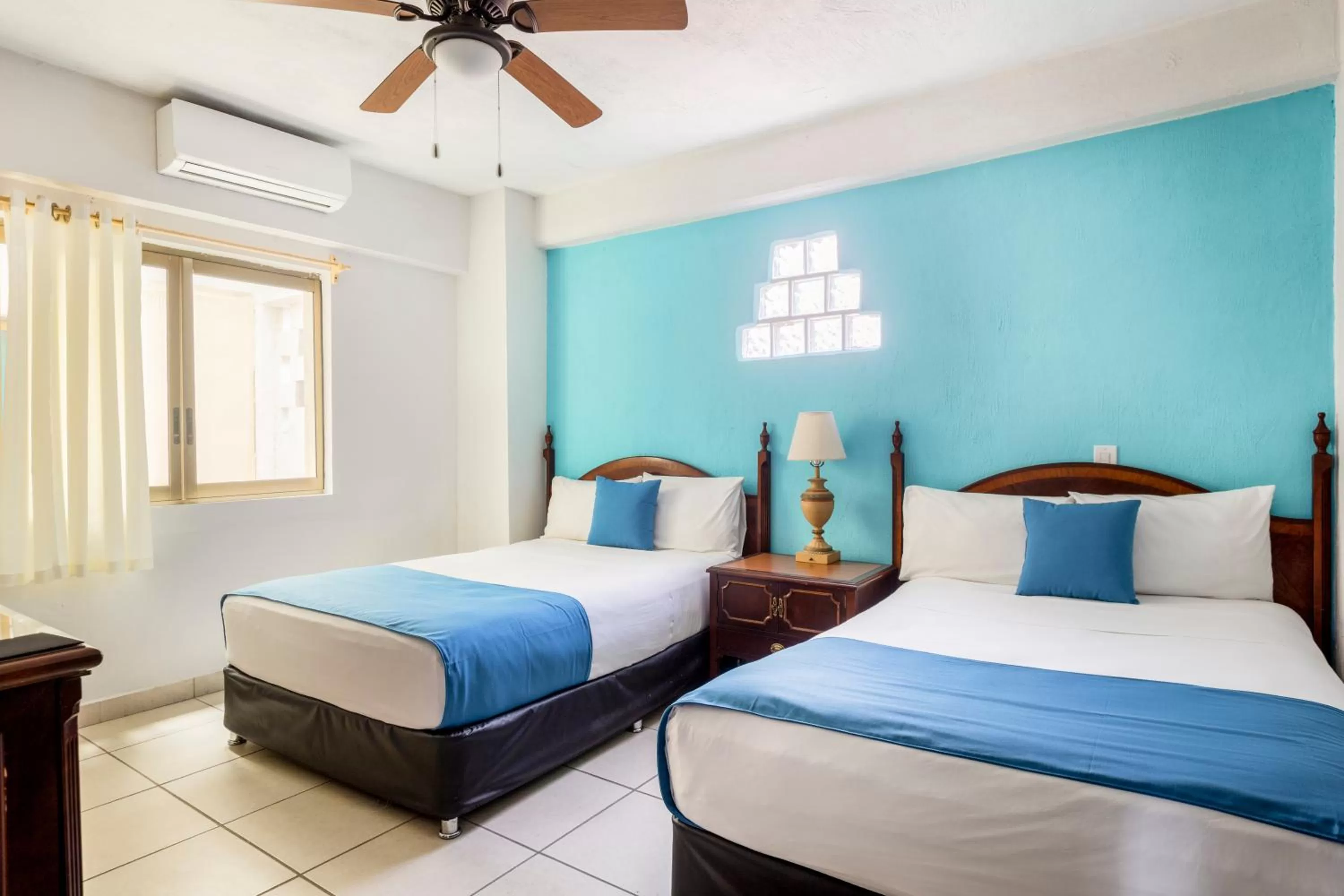 Bed in Hotel Pueblito Vallarta