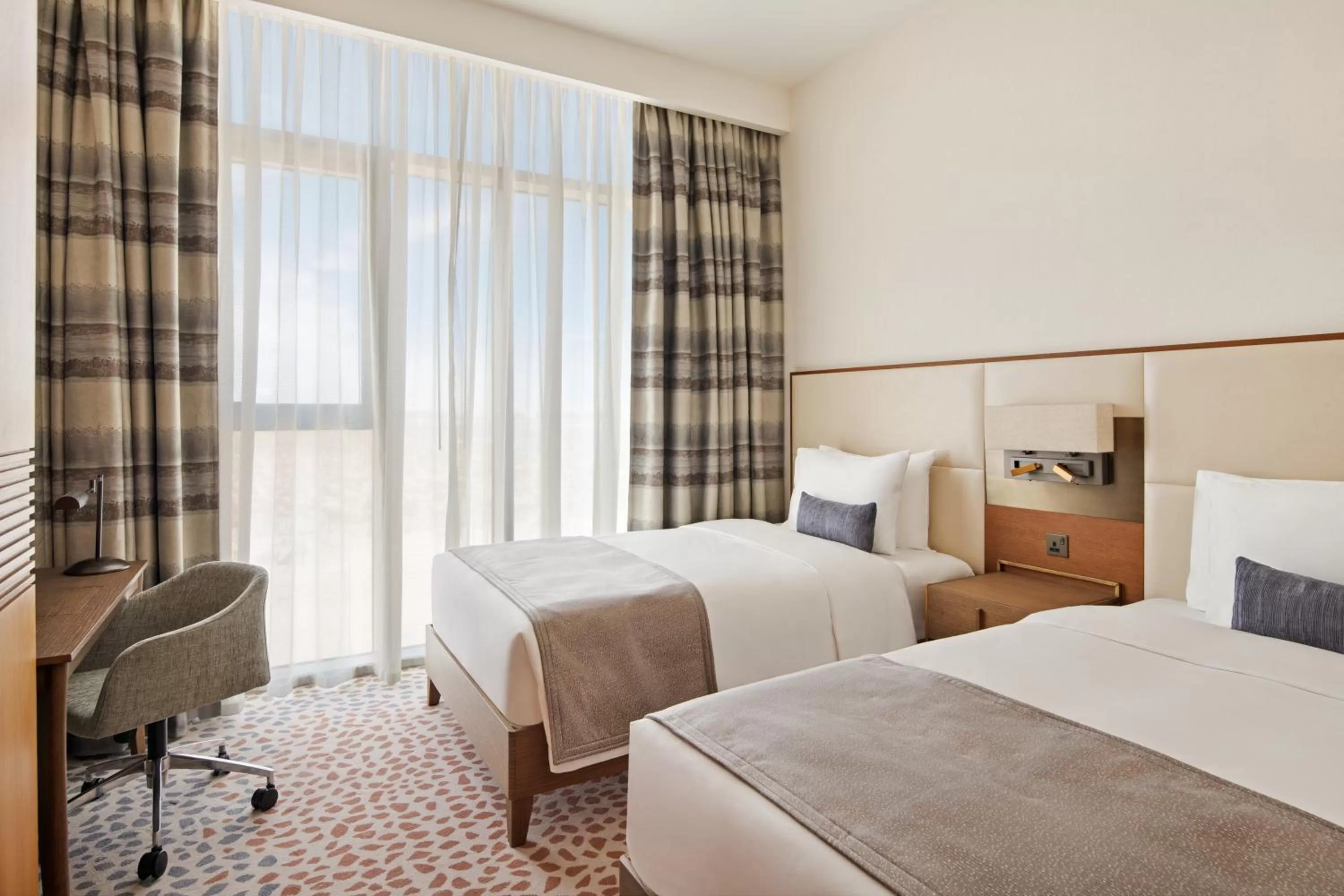 Bed in Staybridge Suites Dubai Al-Maktoum Airport by IHG