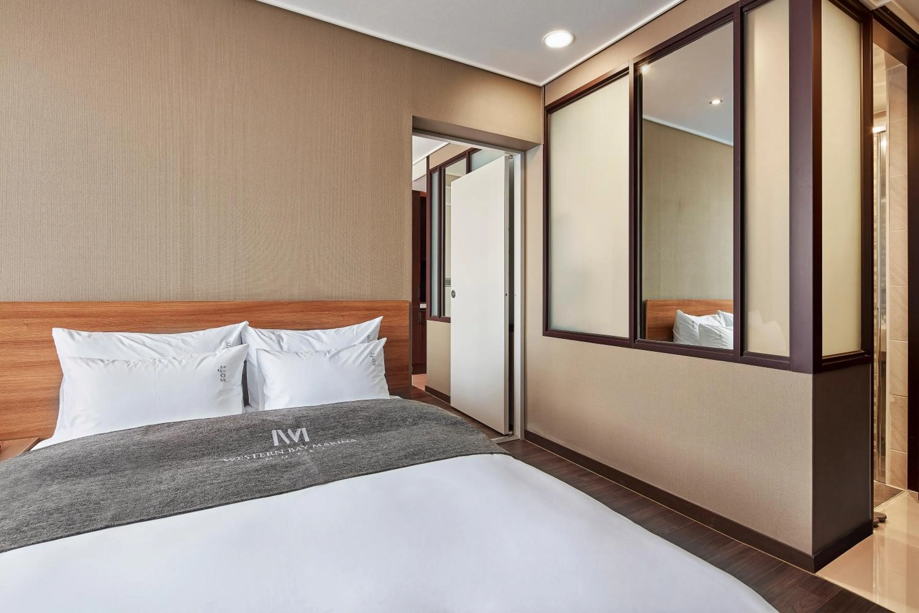 Bed in Western Bay Marina Hotel