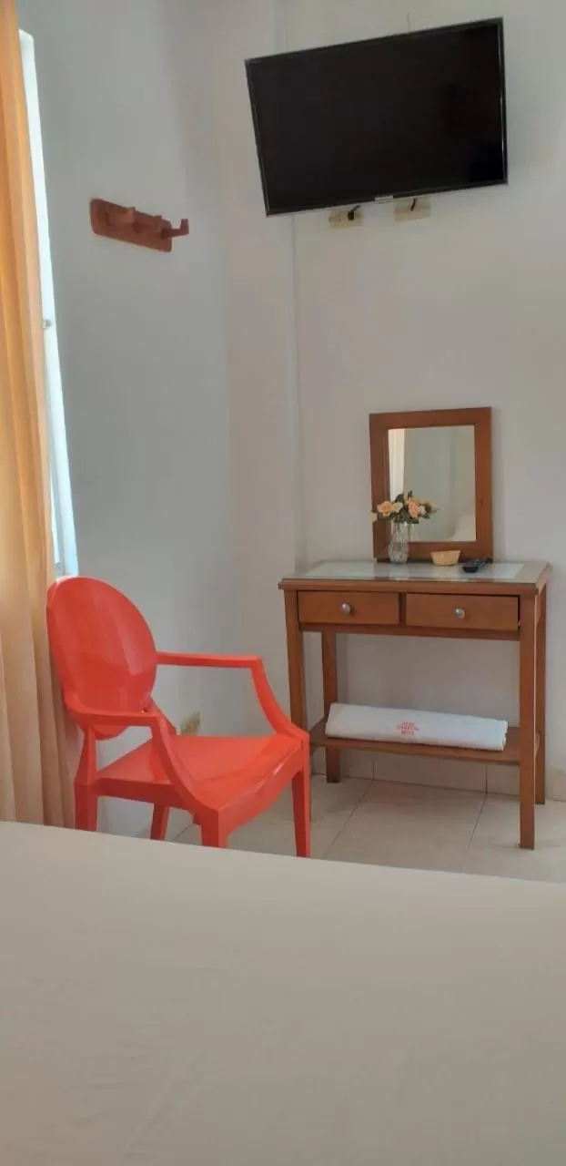 Bedroom, TV/Entertainment Center in Hotel Comercial Neiva
