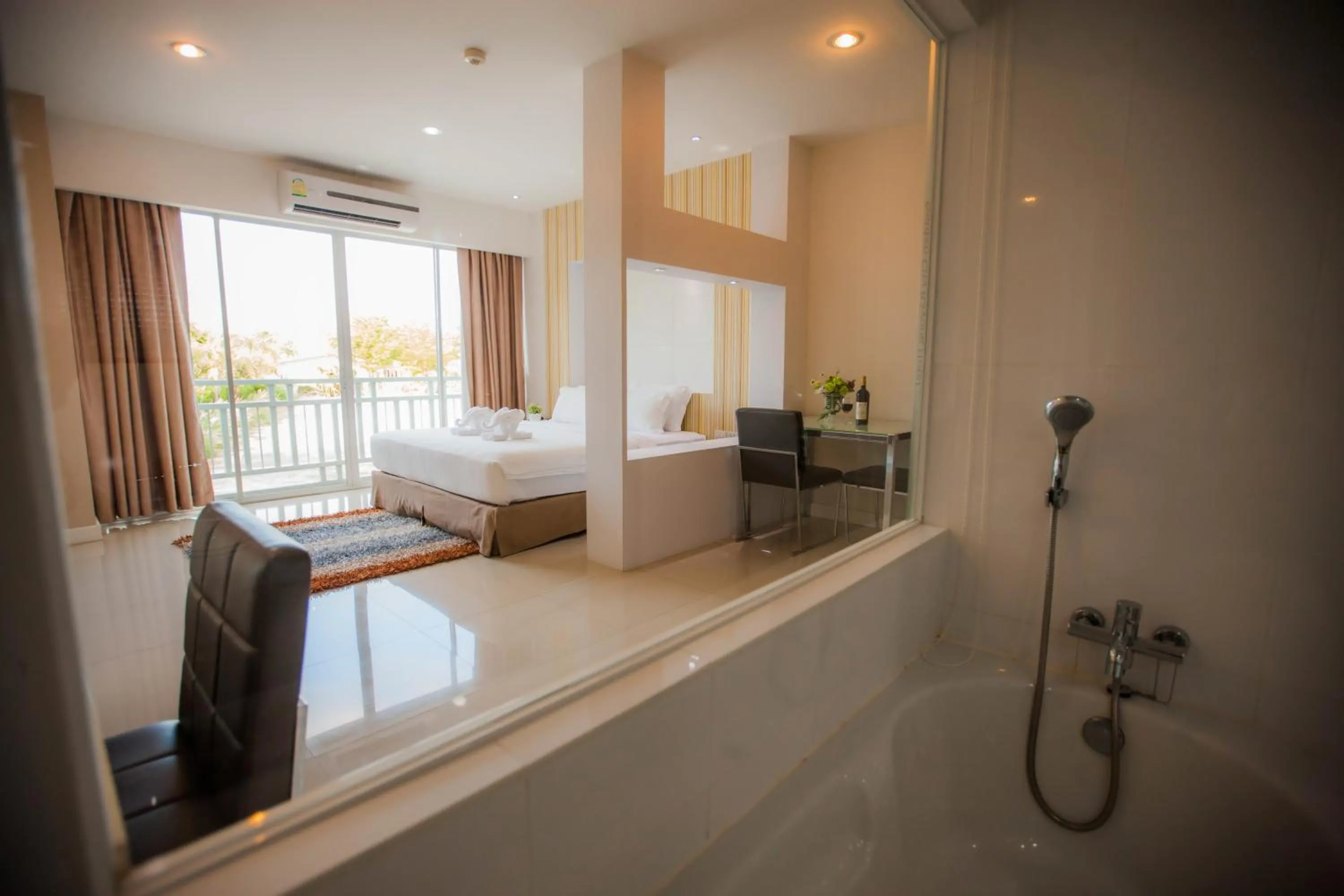 Bathroom, Bed in Golden City Rayong Hotel