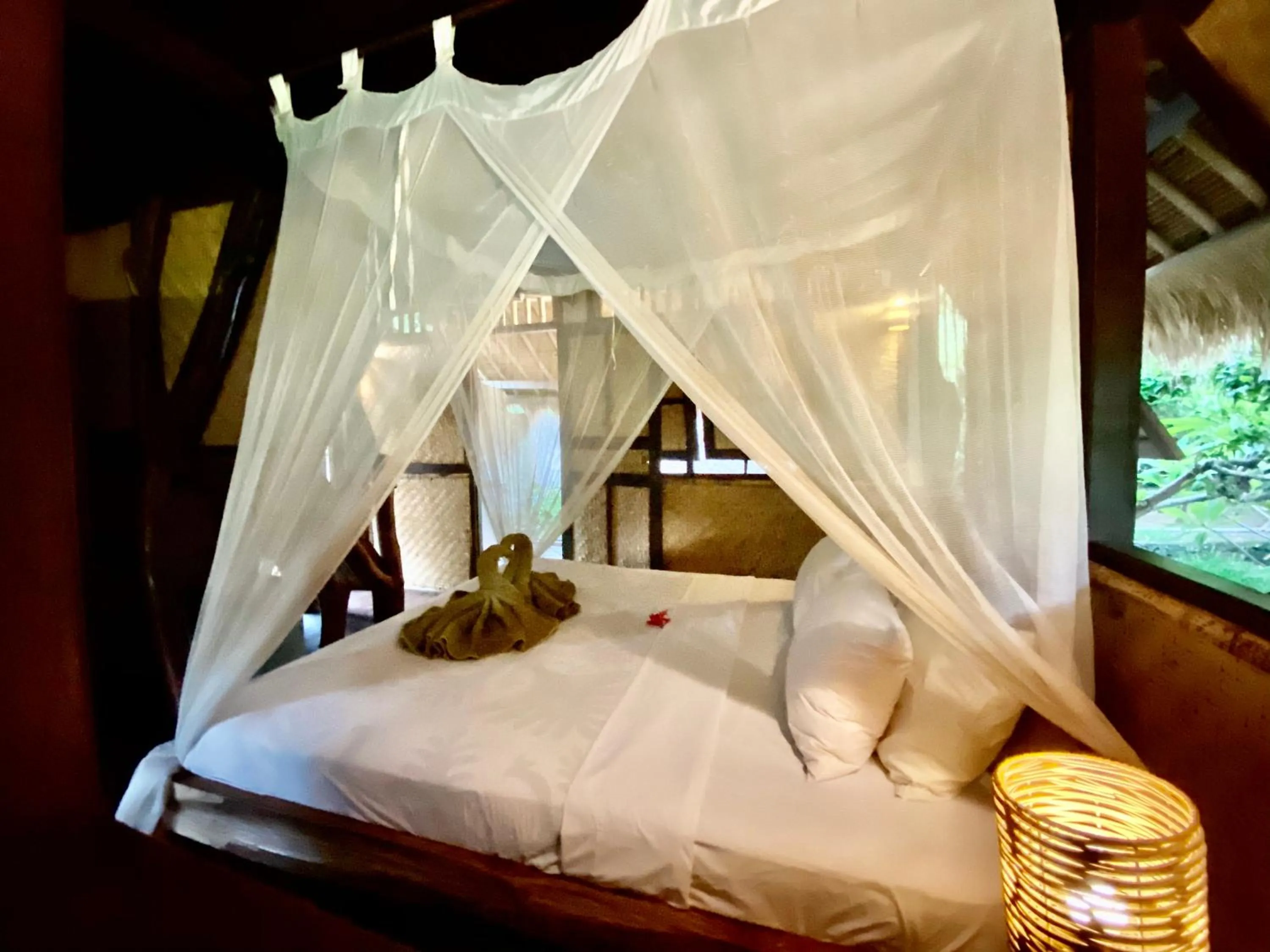 Bed in Flower Bud Bungalow Balangan