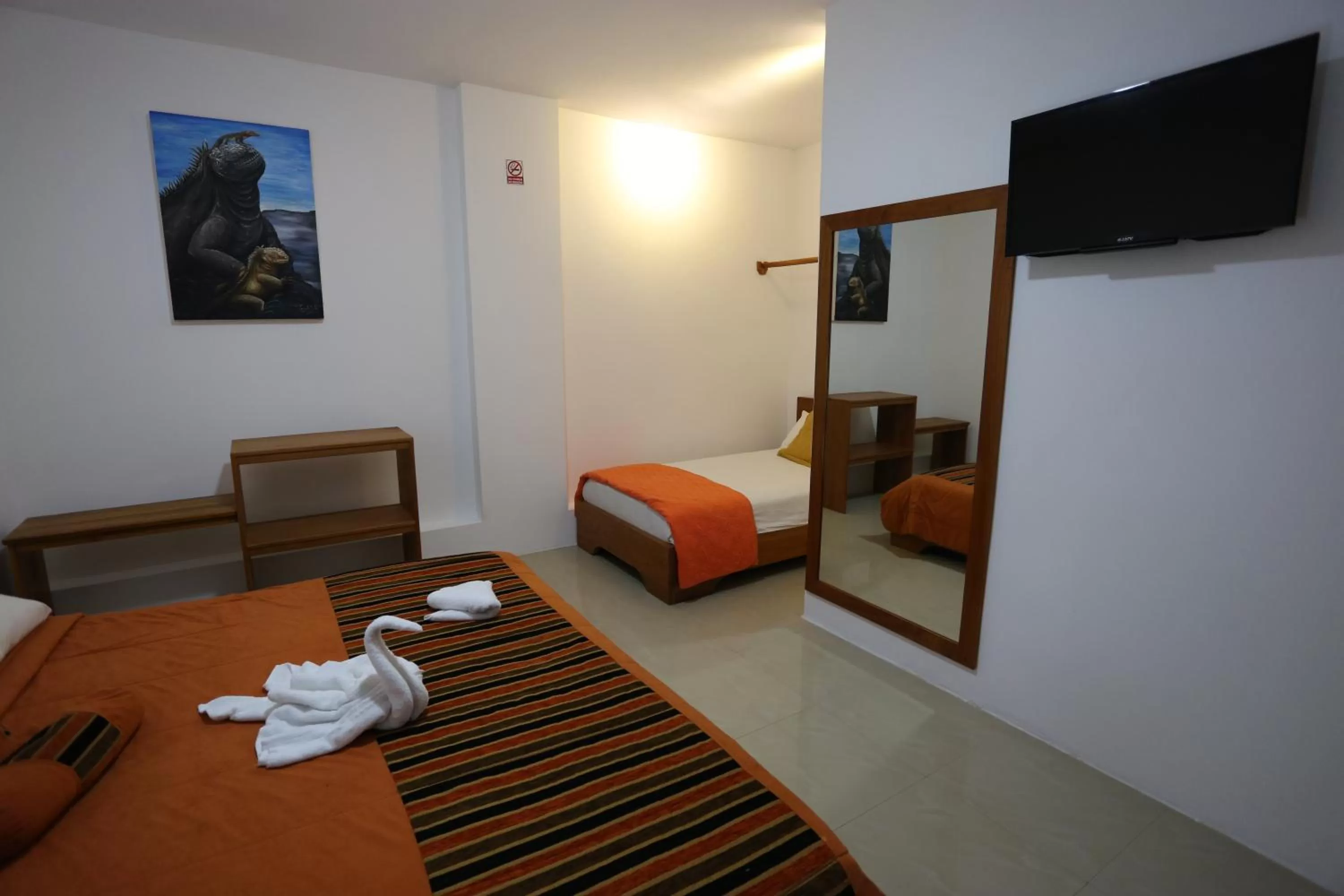 Bedroom, TV/Entertainment Center in The Galapagos Pearl B&B