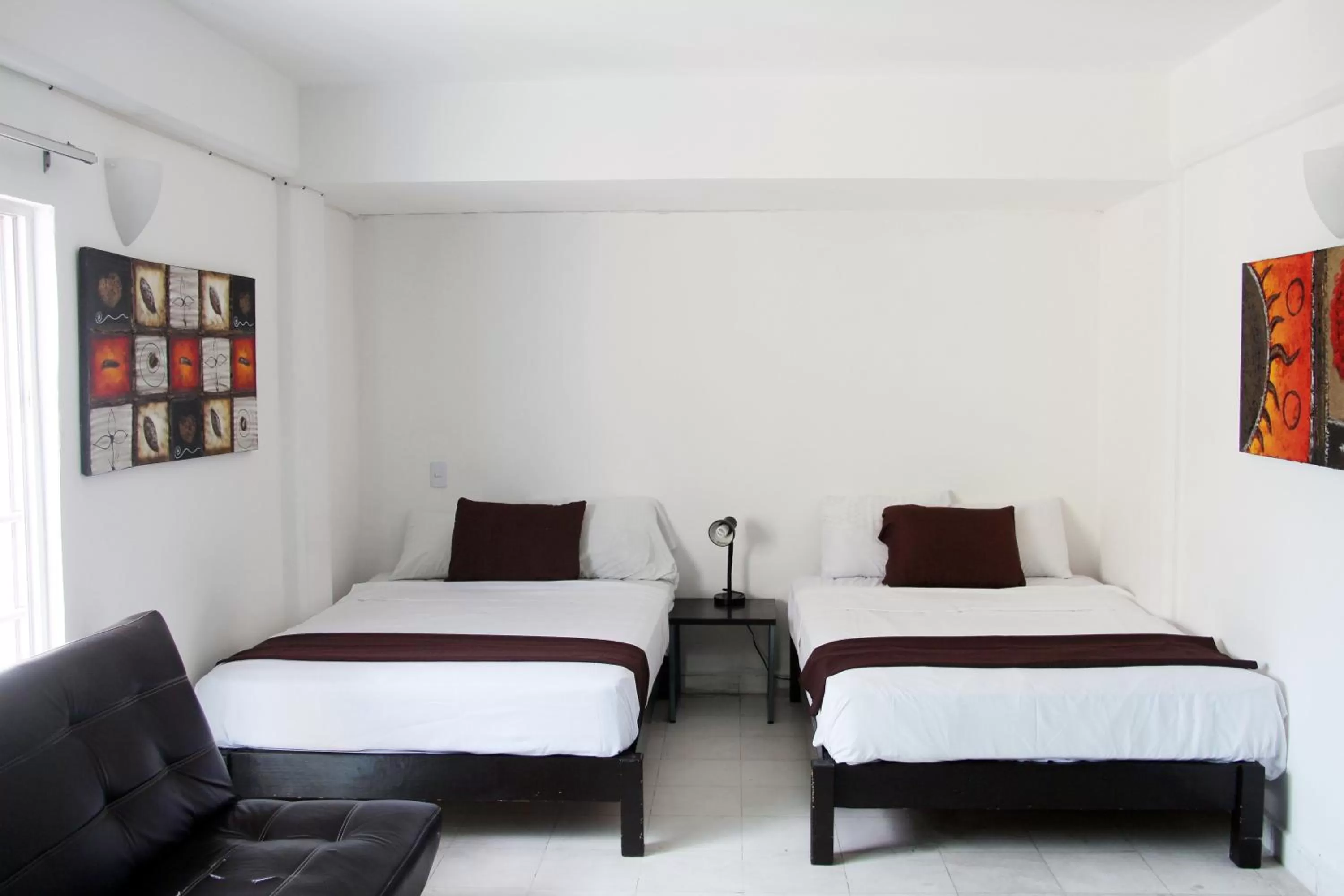 Photo of the whole room, Bed in Hotel & Hostal Casa de Luz Cancun