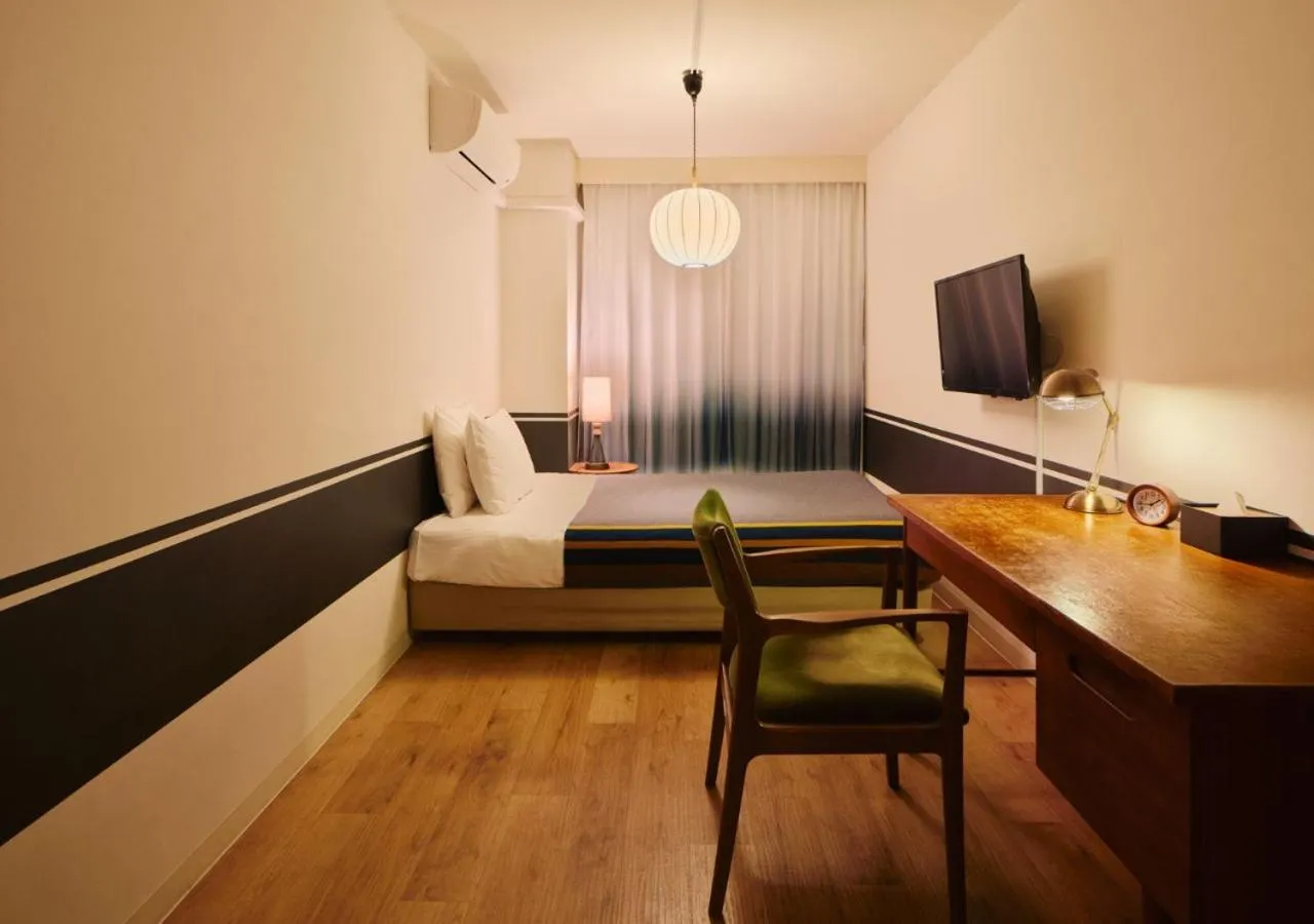 Bed in Hotel Graphy Nezu