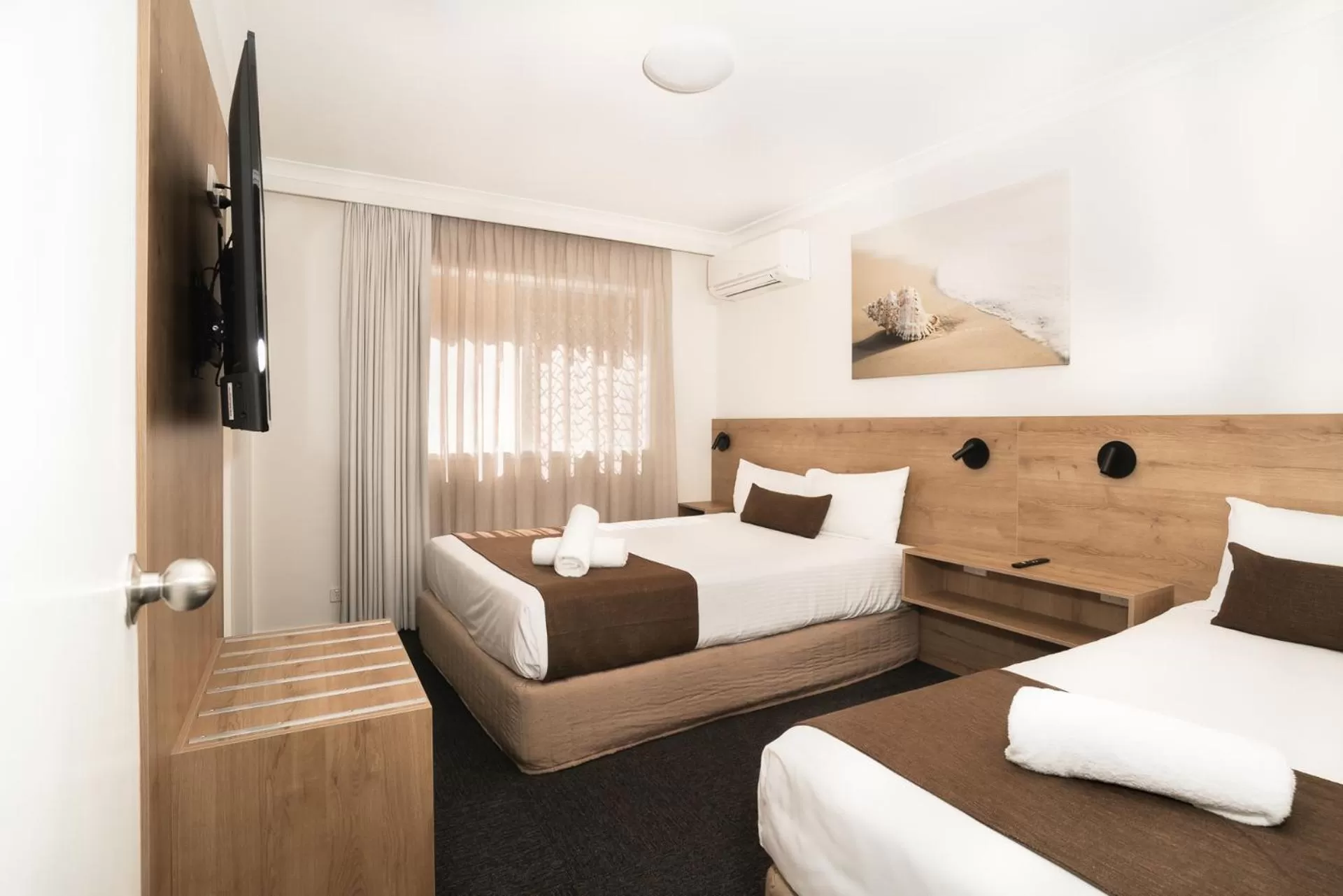 Bed in Caribbean Motel