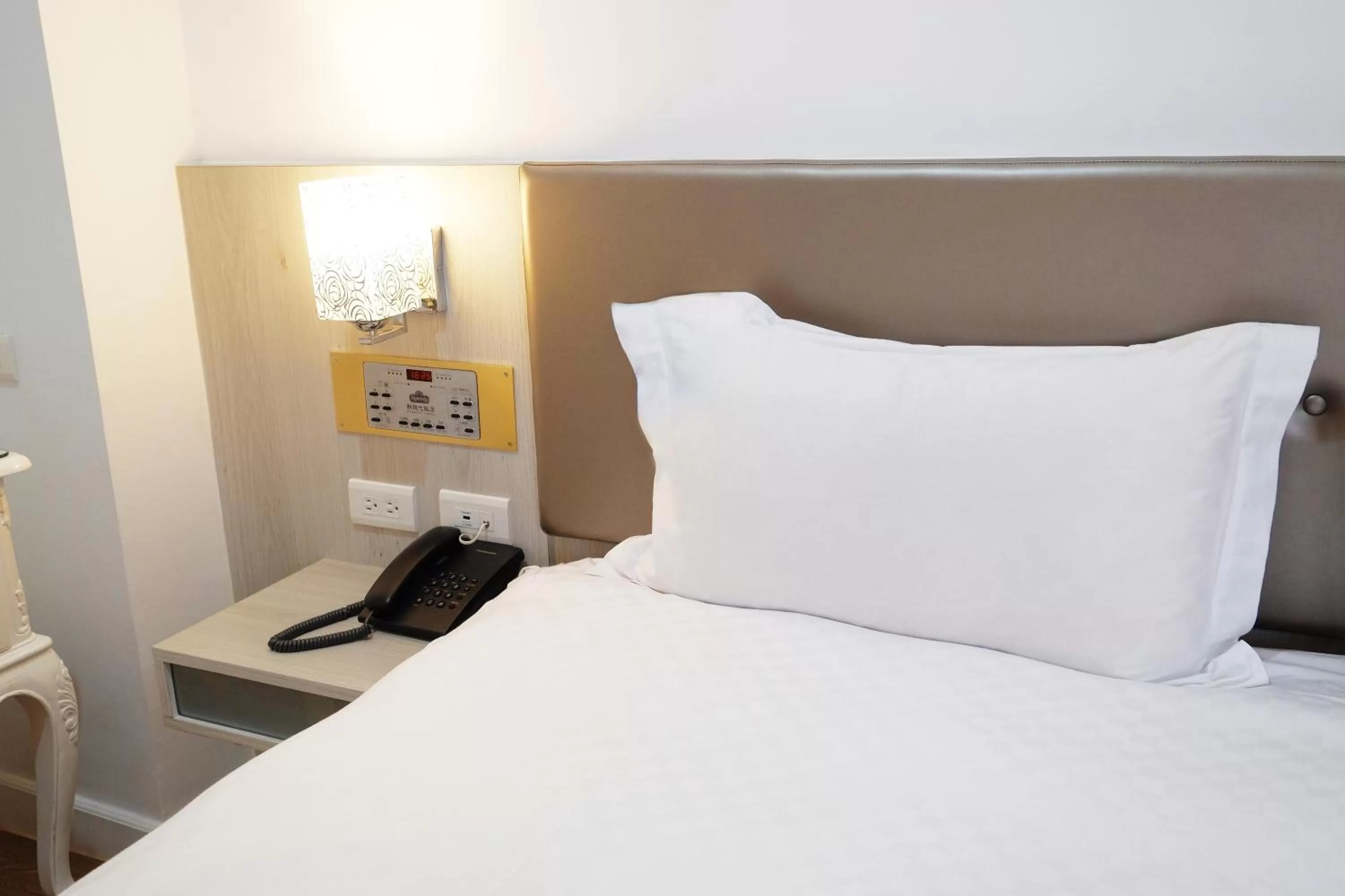 Bed in Dynasty Hotel