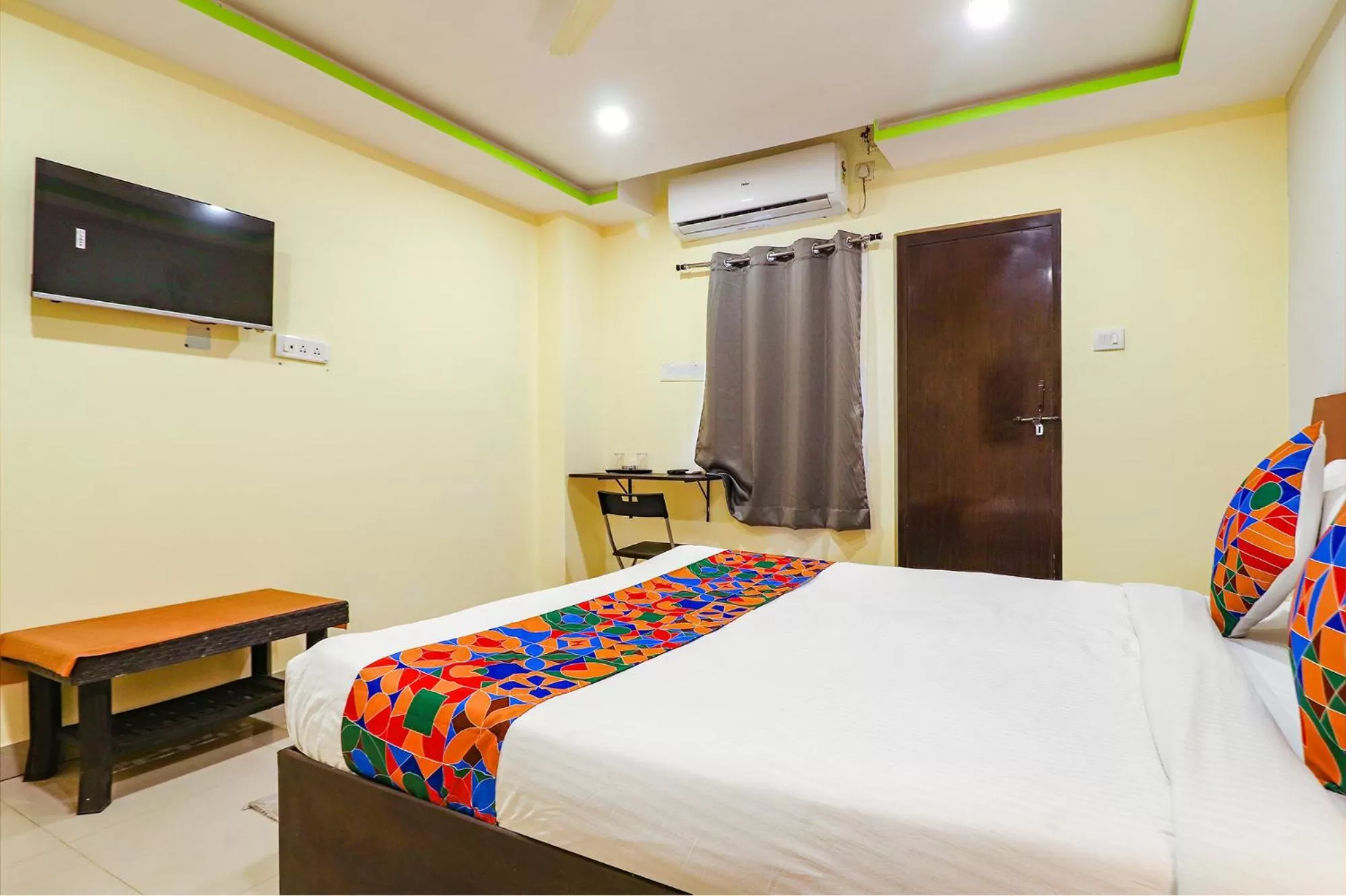 Communal lounge/ TV room, Bed in FabExpress Broholic Suites - Nr JNTU Kukatpally