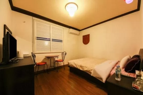 Bed in Saipan Motel with Sea View