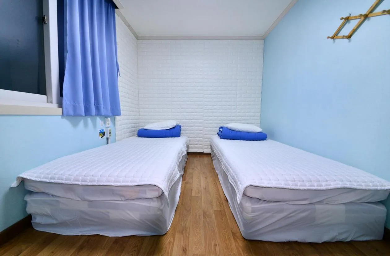 Bed in Gyeongju Namu Guesthouse