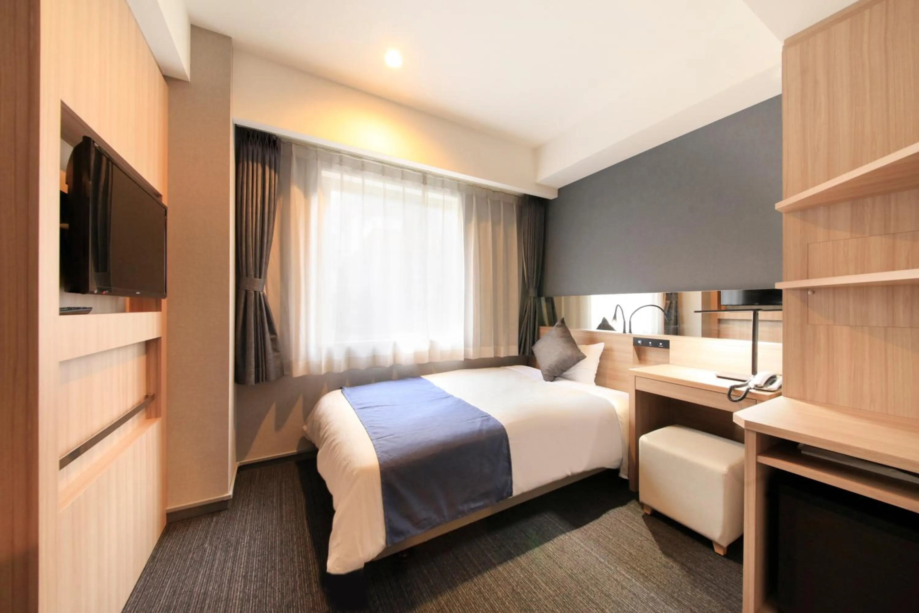 Bed in Quintessa Hotel Osaka Shinsaibashi Comic & Books