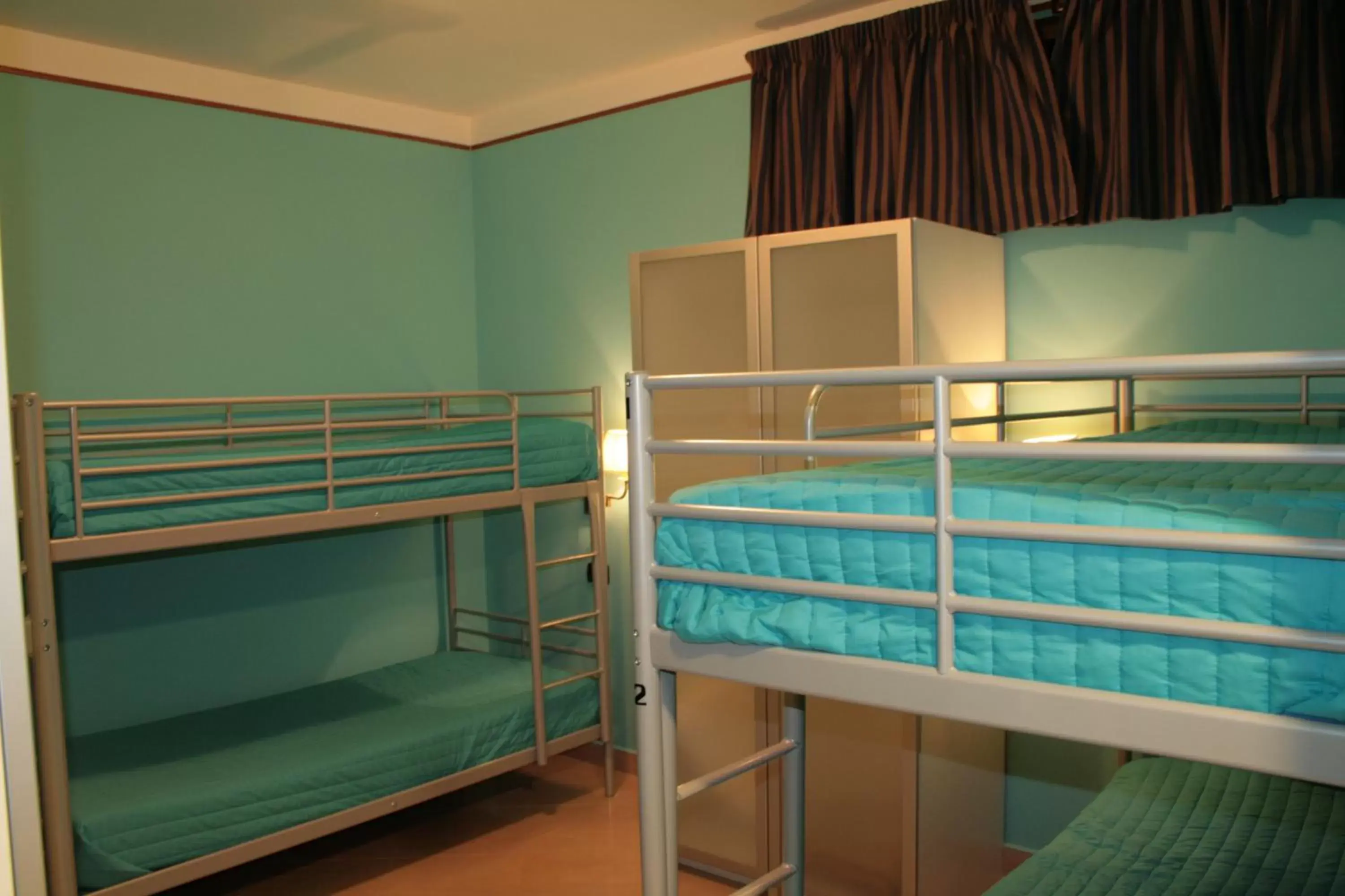 Bed in 6-Bed Male Dormitory Room in Ulisse Deluxe Hostel Bed in 6-Bed Male Dormitory Room in Ulisse Deluxe Hostel