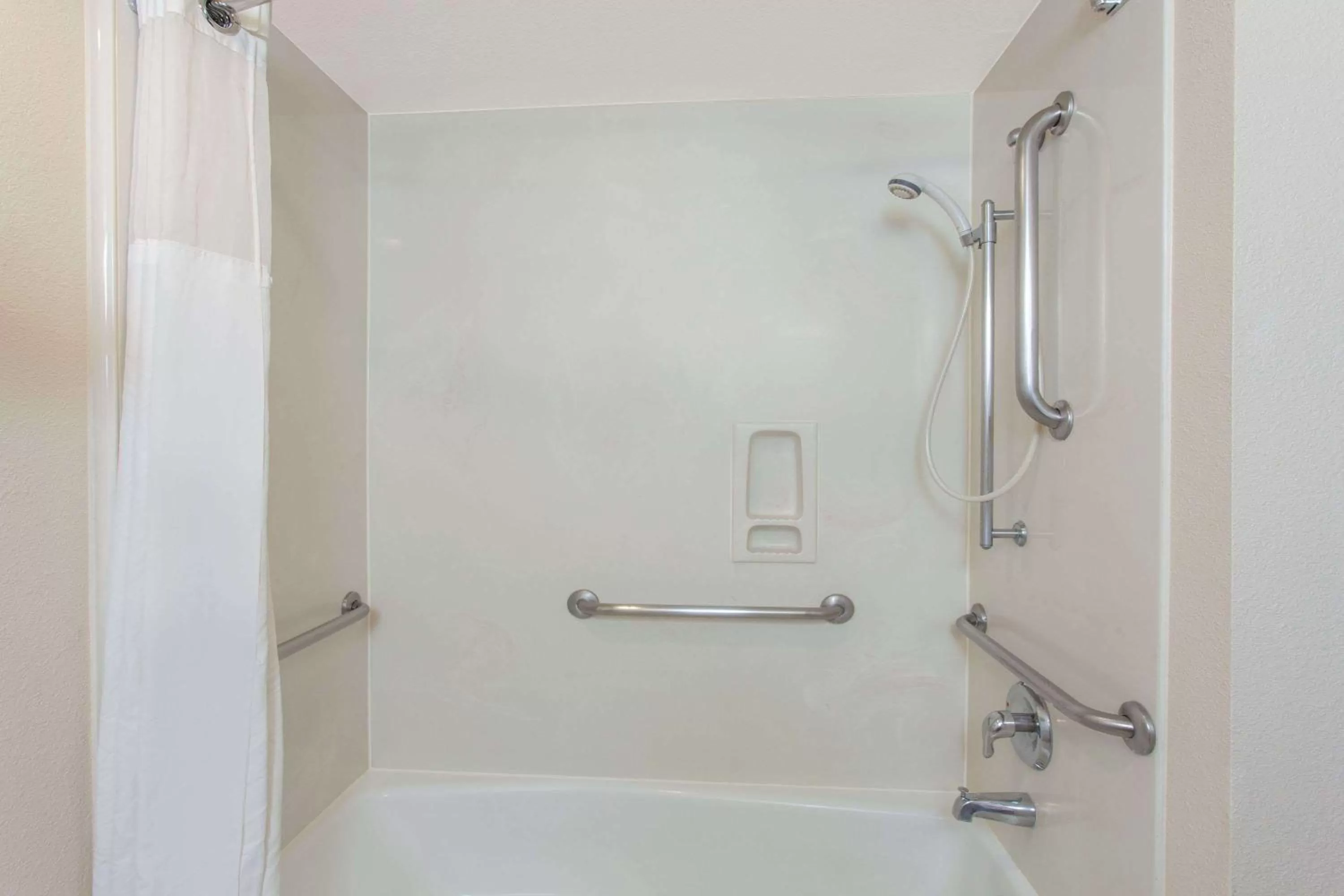 Bathroom in Ramada by Wyndham Fresno Northwest