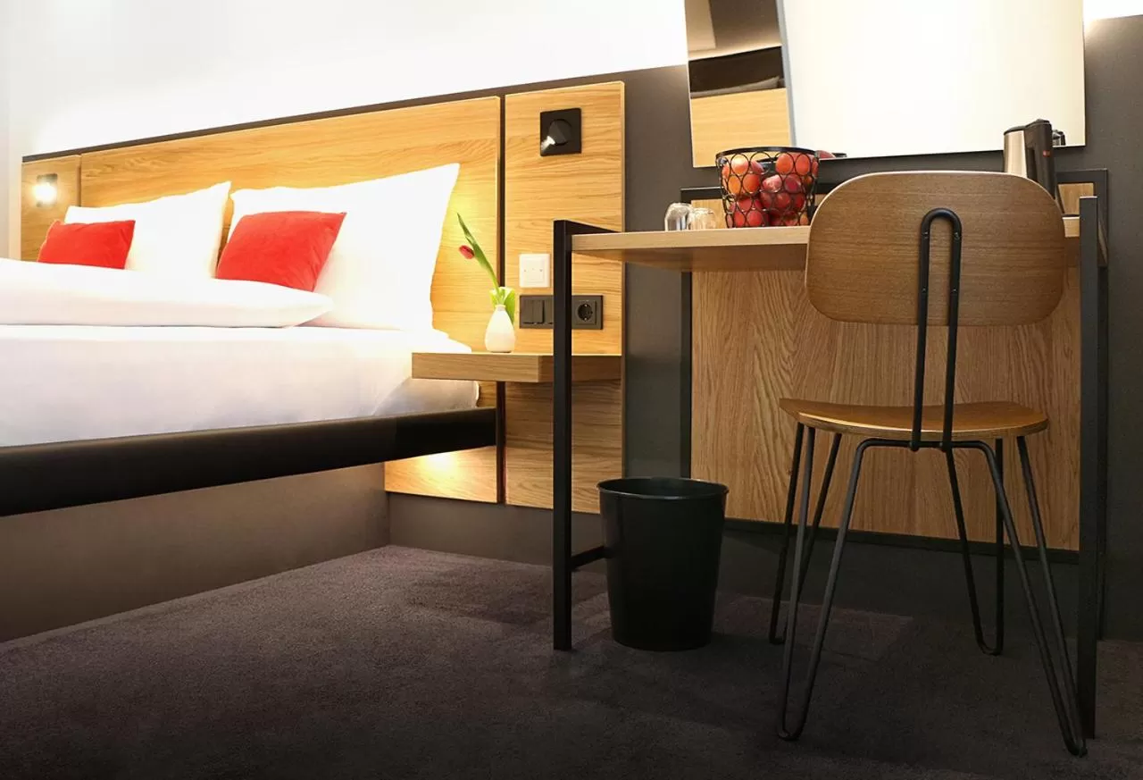 Living room, Bed in GINN City and Lounge Ravensburg