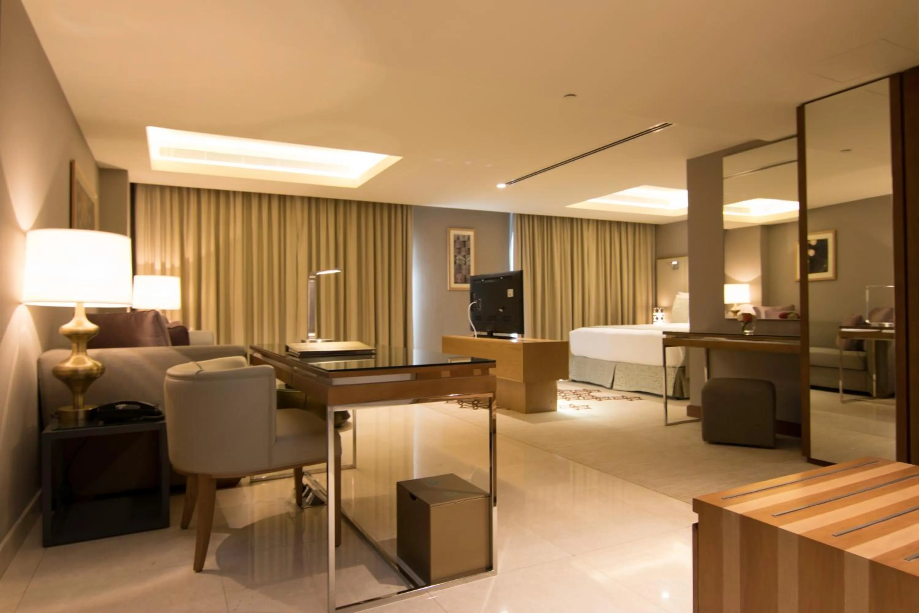 Seating area, Bed in Grand Millennium Muscat