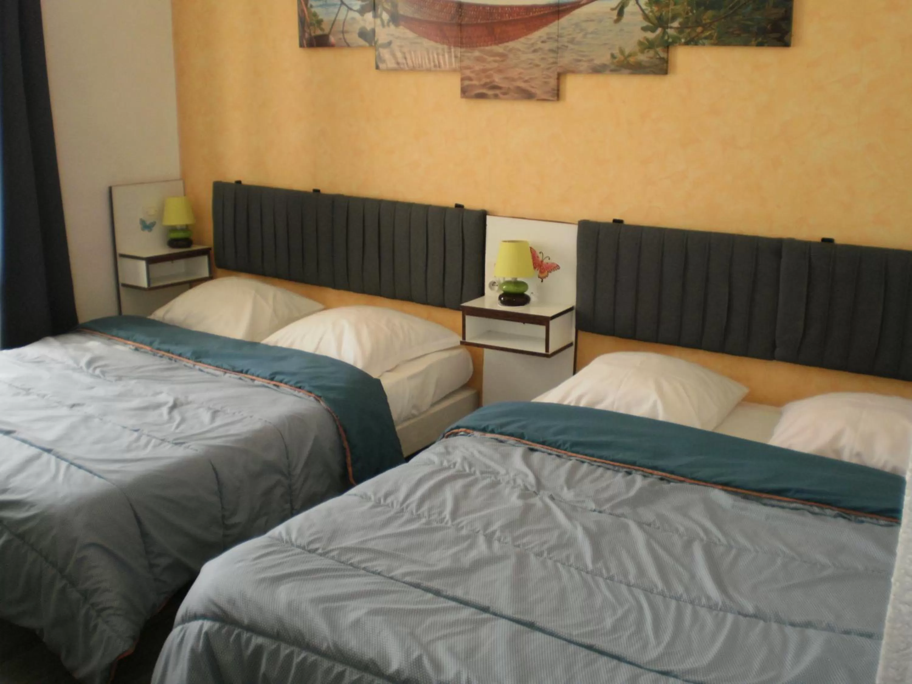 Quadruple Room with two Full Beds (2 Adults + 2 Children) in Hotel De La Gare