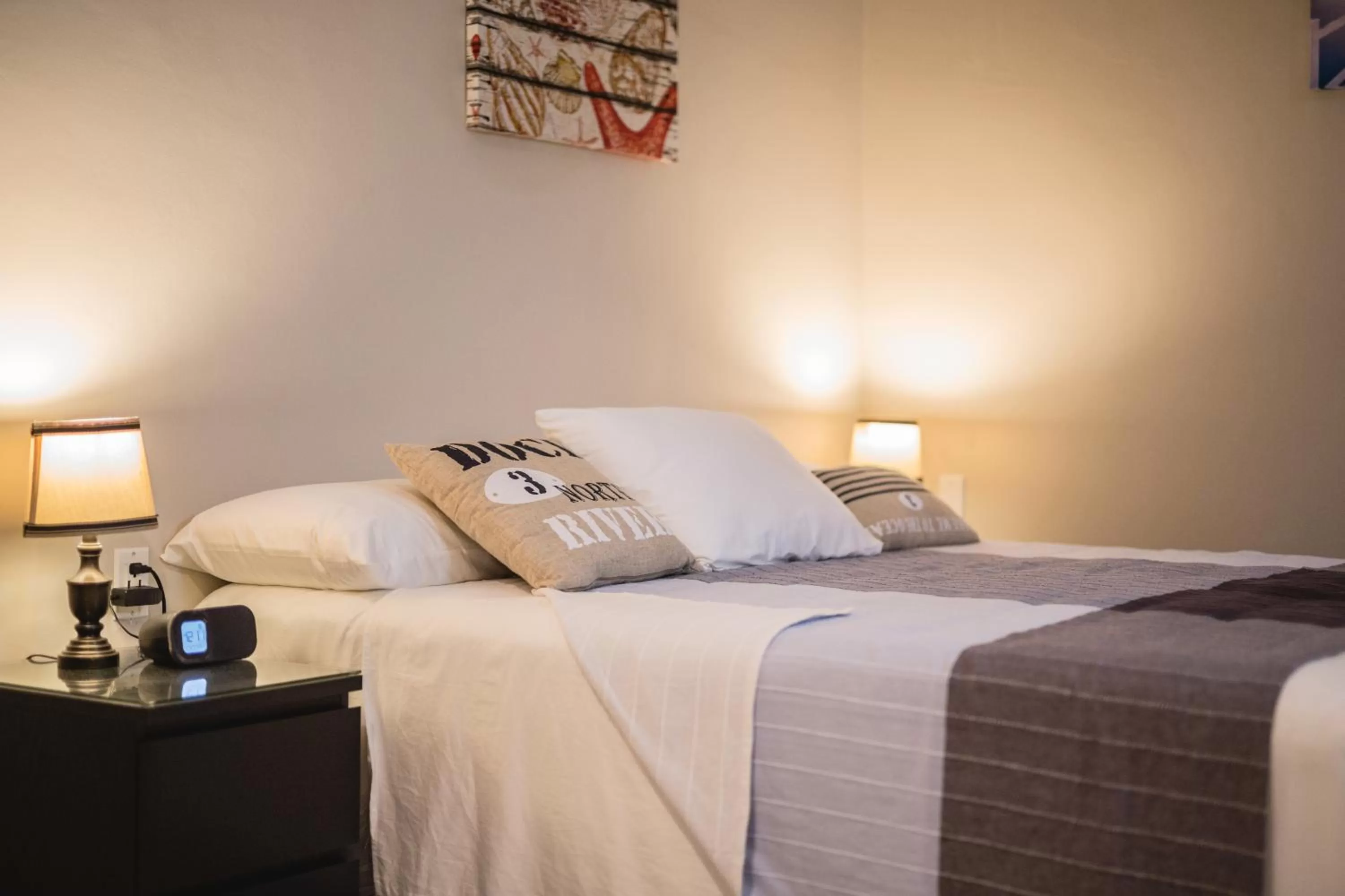 Bed in The Pier Beach Inn & Suites