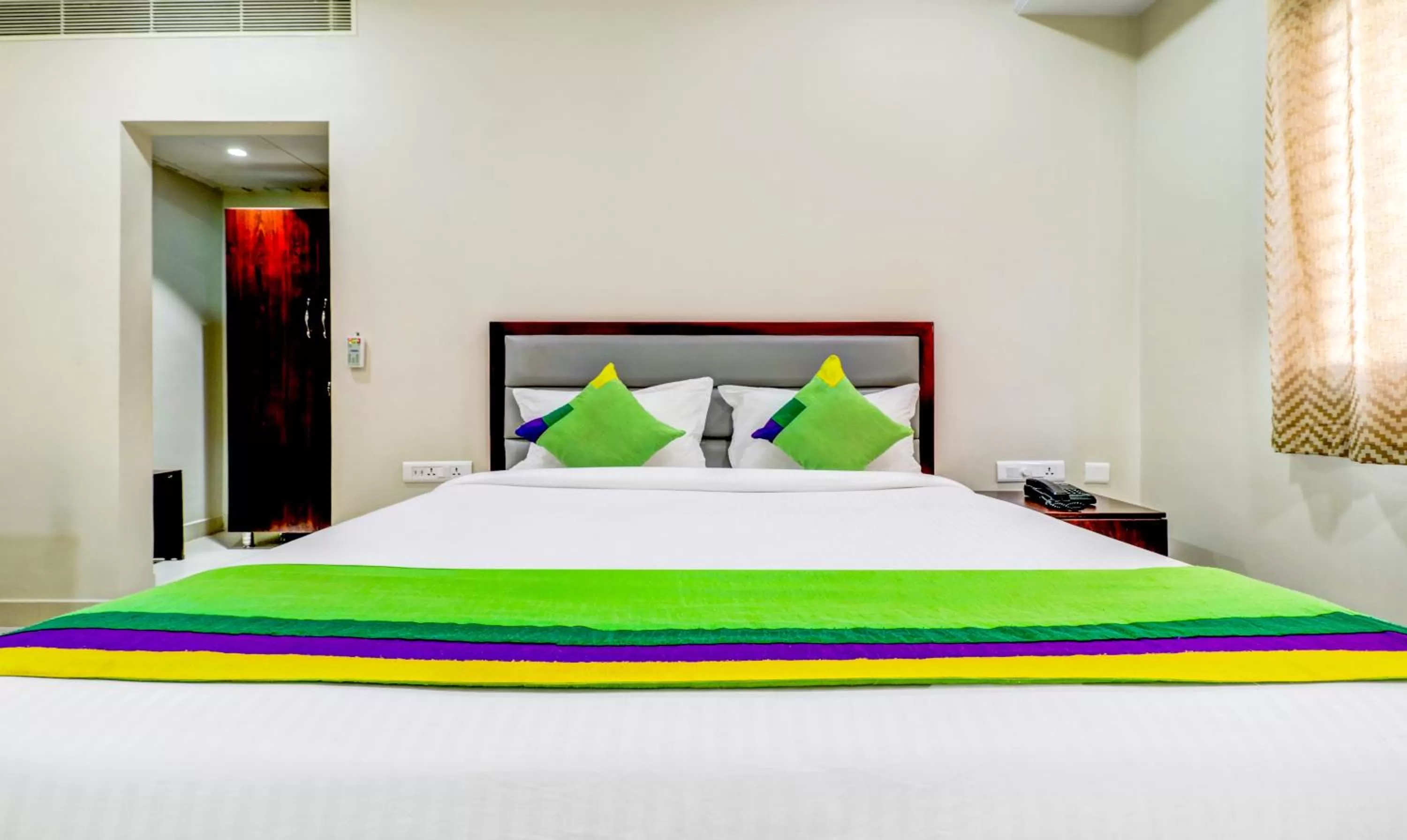 Bedroom, Bed in Treebo Grand Milan